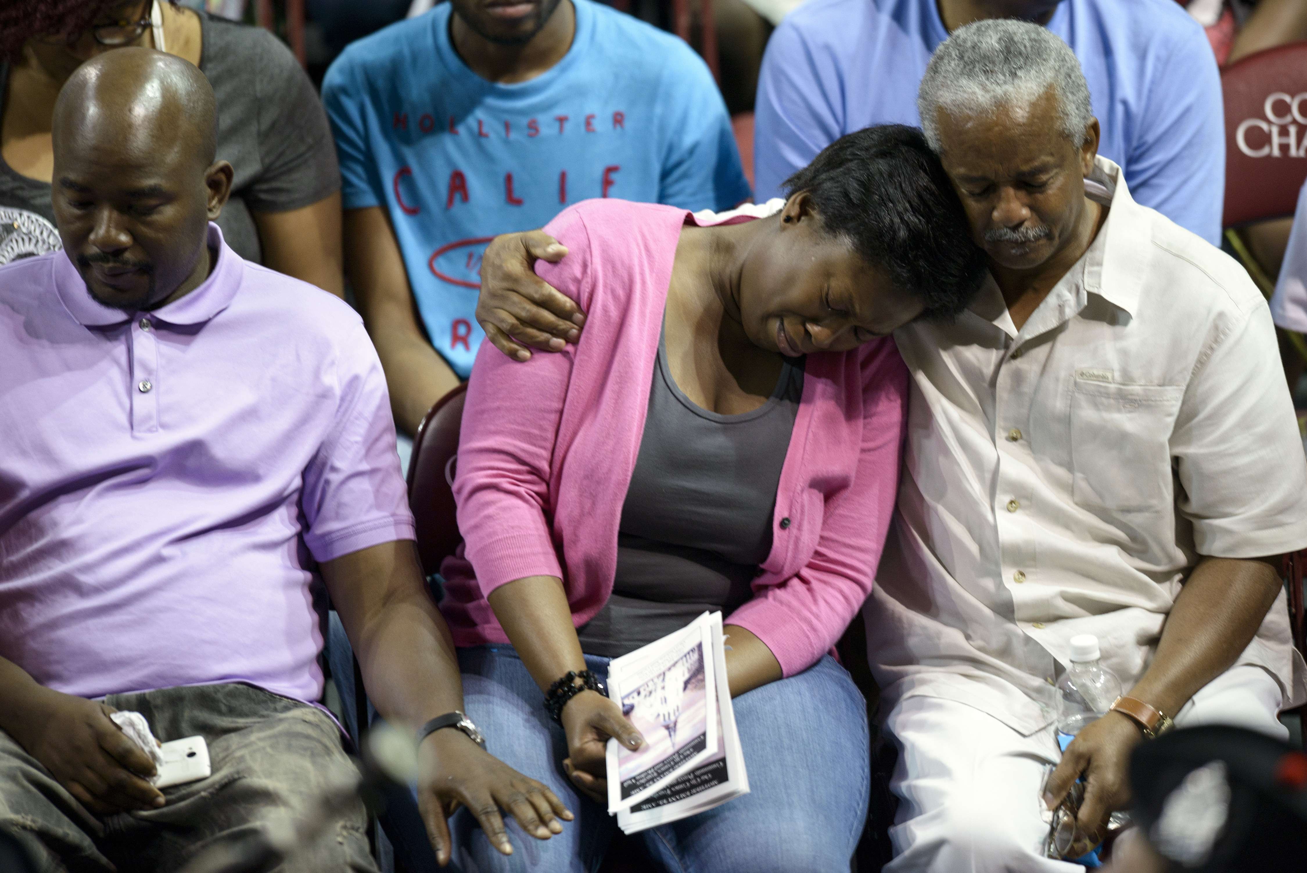 Mourners gathered at a Charleston vigil on Friday for victims of the Emanuel African Methodist Episcopal Church shooting.