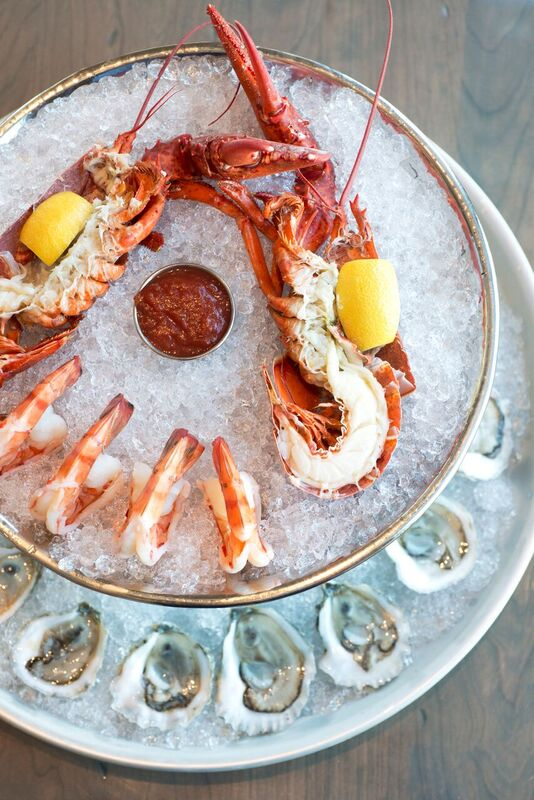 A spread of oysters, shrimp, and lobster.