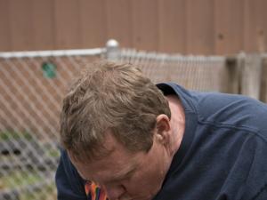 Student Wes Arneson kissed an alligator while keeping its jaws clamped shut during a wrestling course at Colorado Gators Reptile Park.