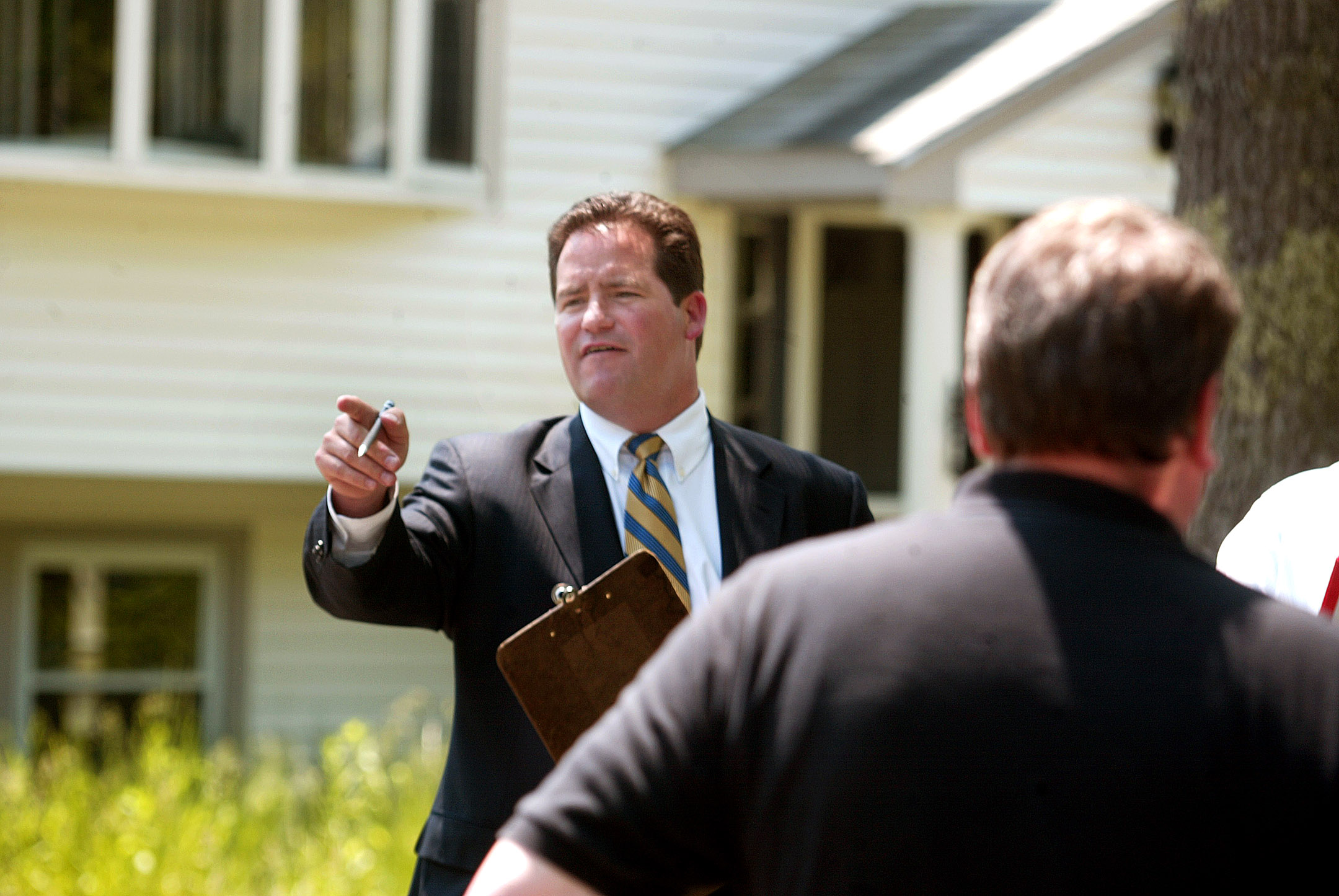 Dan Flynn took bids from prospective buyers during a foreclosure auction in Halifax.