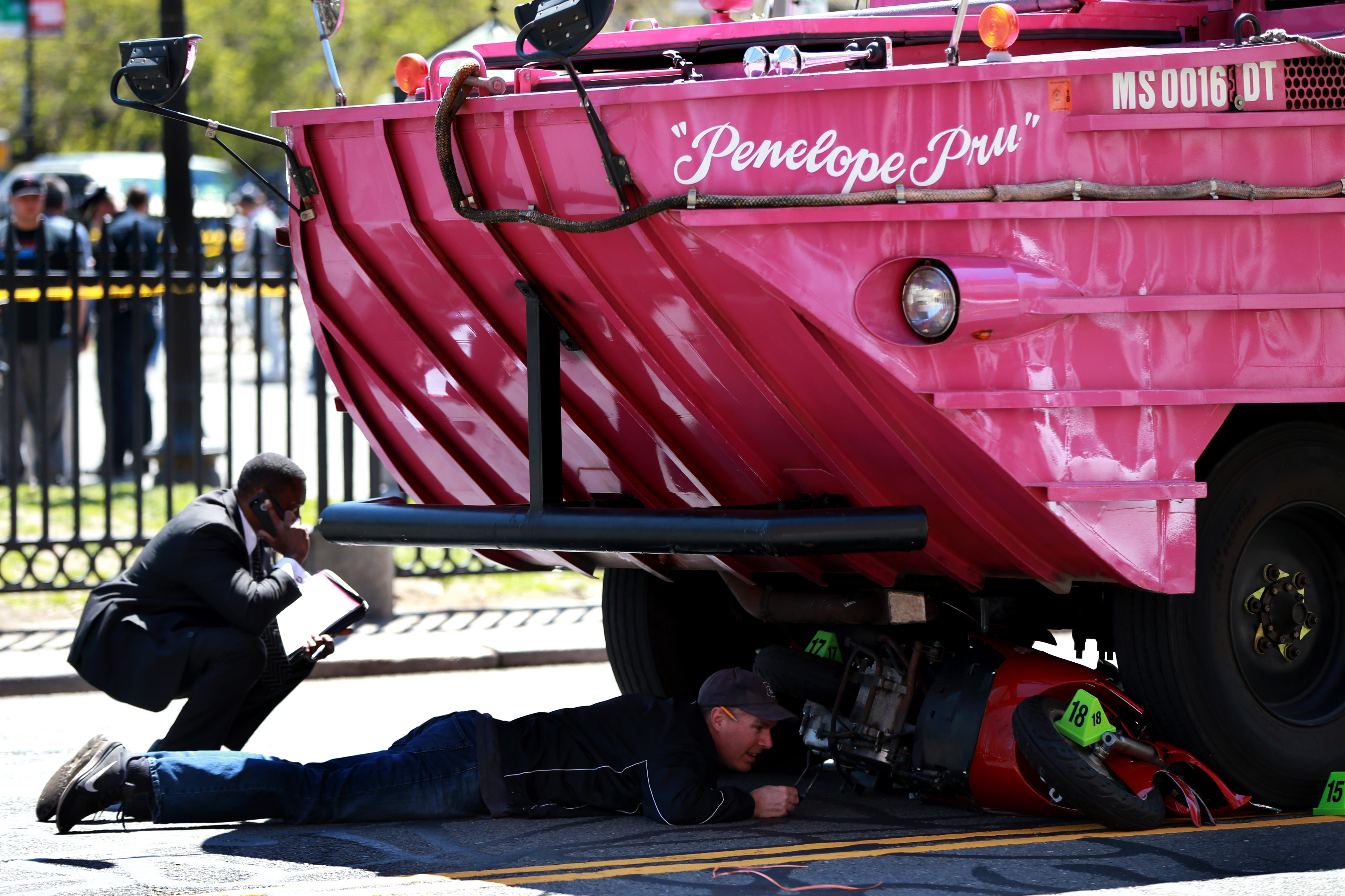 Investigators reviewed the scene of the April 30 crash in which a woman riding a scooter was struck and killed by a duck boat.