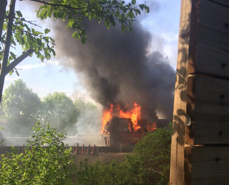 A bus was seen in flames on the Mass. Pike Monday afternoon.