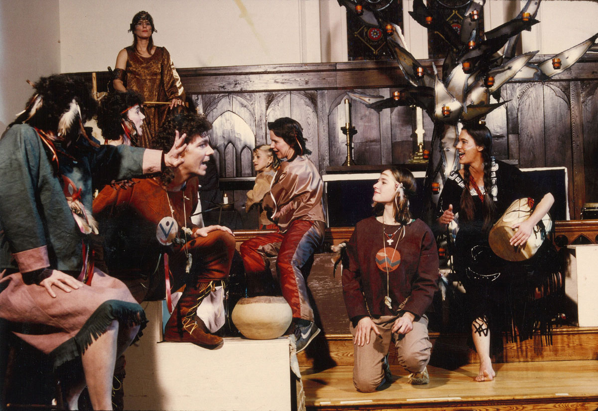 A scene from a “Night Fires” dress rehearsal. A very young Mitchell is being hoisted over a rail.