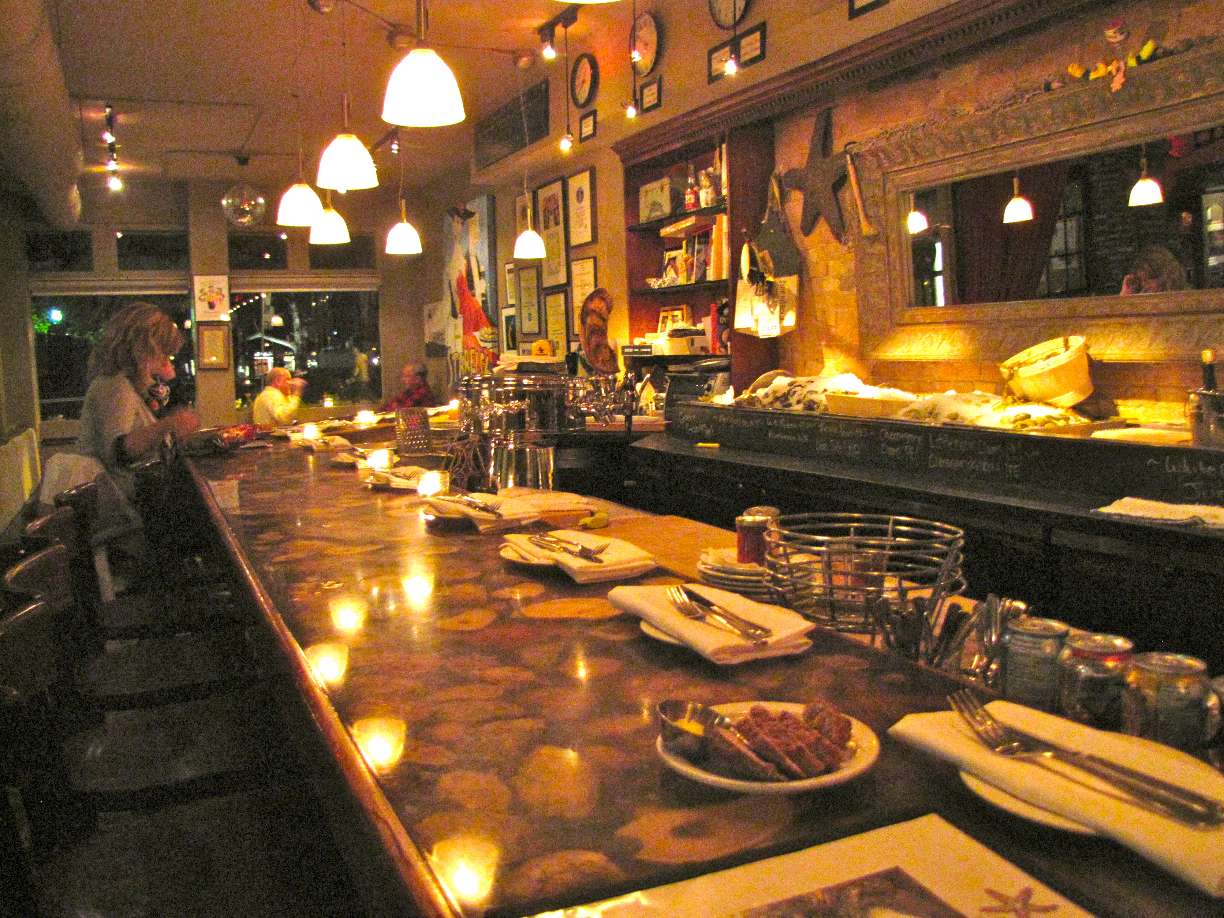 04torontooysters - In Toronto, the Starfish Oyster Bed & Grill's bar is topped with oyster shells encased in resin. (Necee Regis)