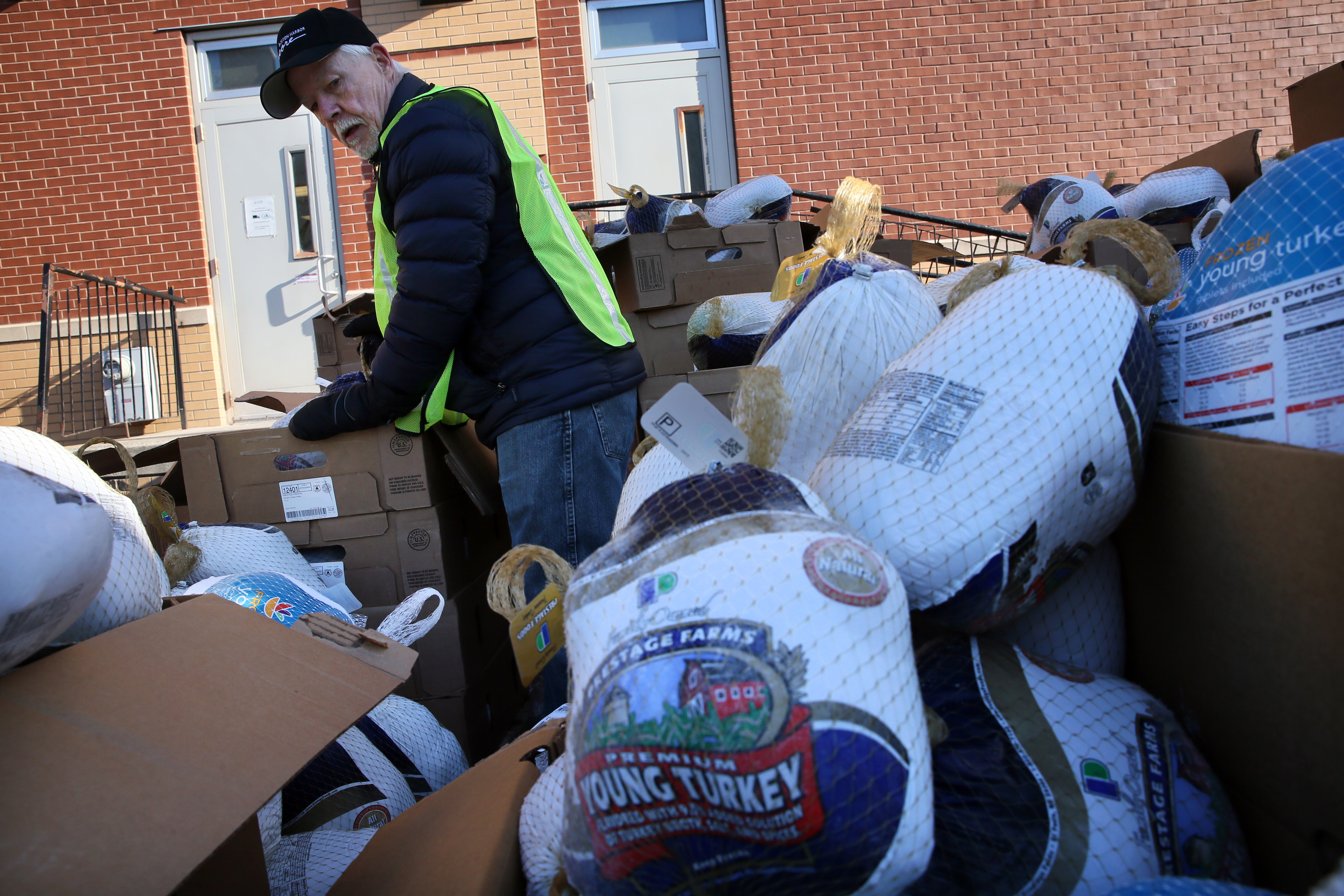 Volunteer Fred Plett unpacked turkeys Saturday.