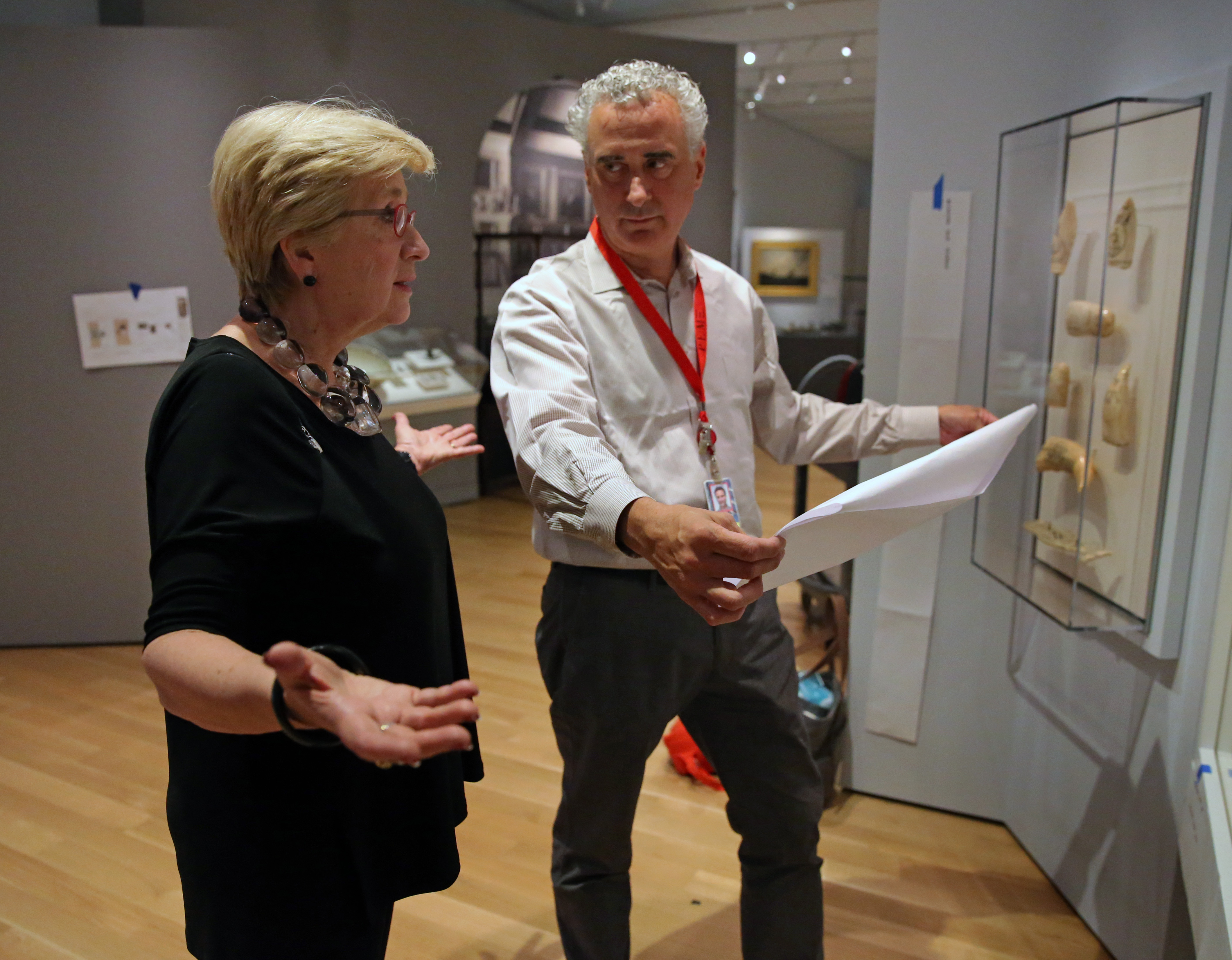 Lynda Roscoe Hartigan, deputy director and chief curator, goes over plans with Dan Finamorne, curator of the Maritime History exhibit.