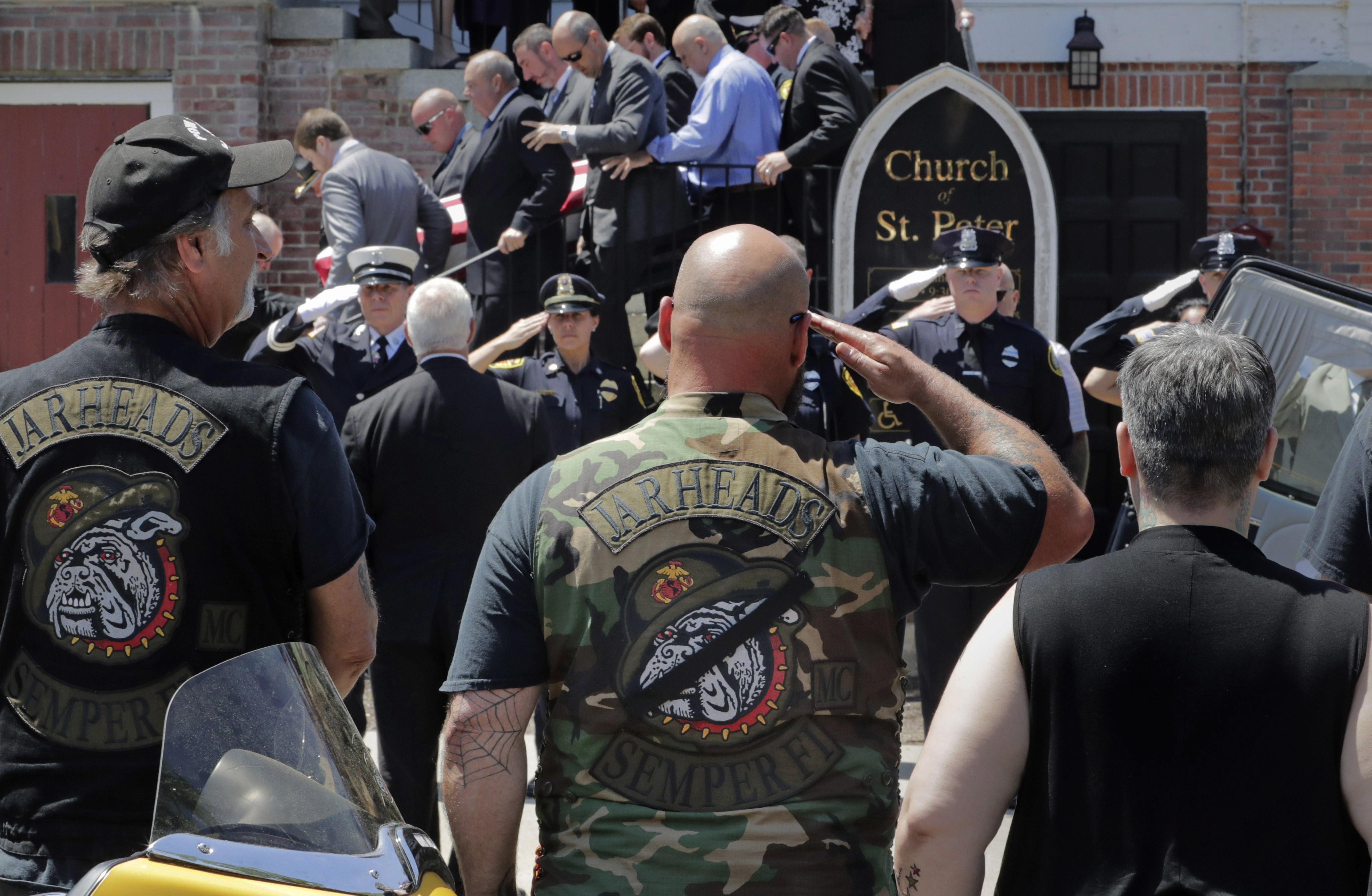 Members of the Jarheads Motorcycle Club and a police honor guard saluted as the casket of Michael Ferazzi was loaded into a hearse.