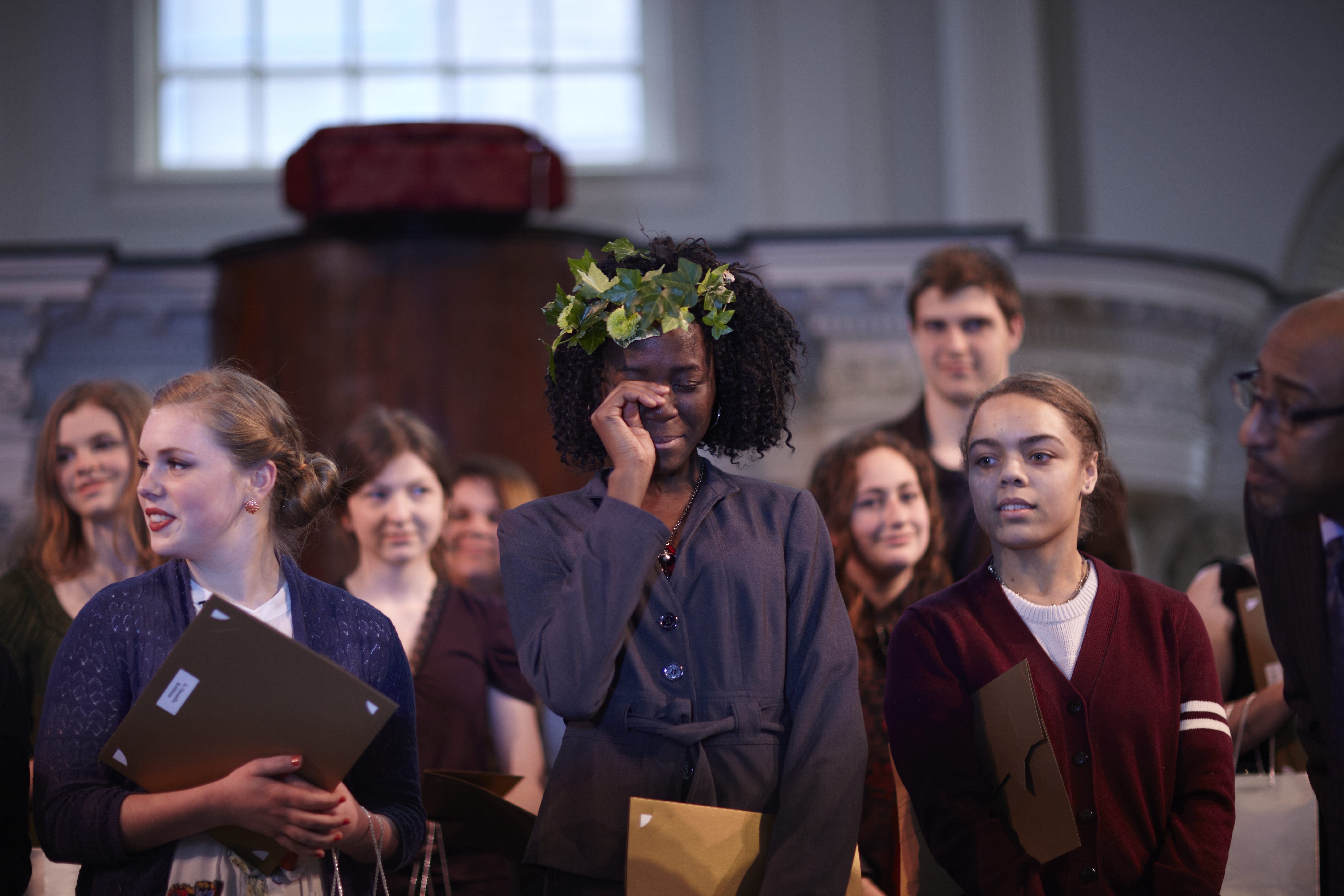 Stephanie Igharosa crying after winning the poetry competition.