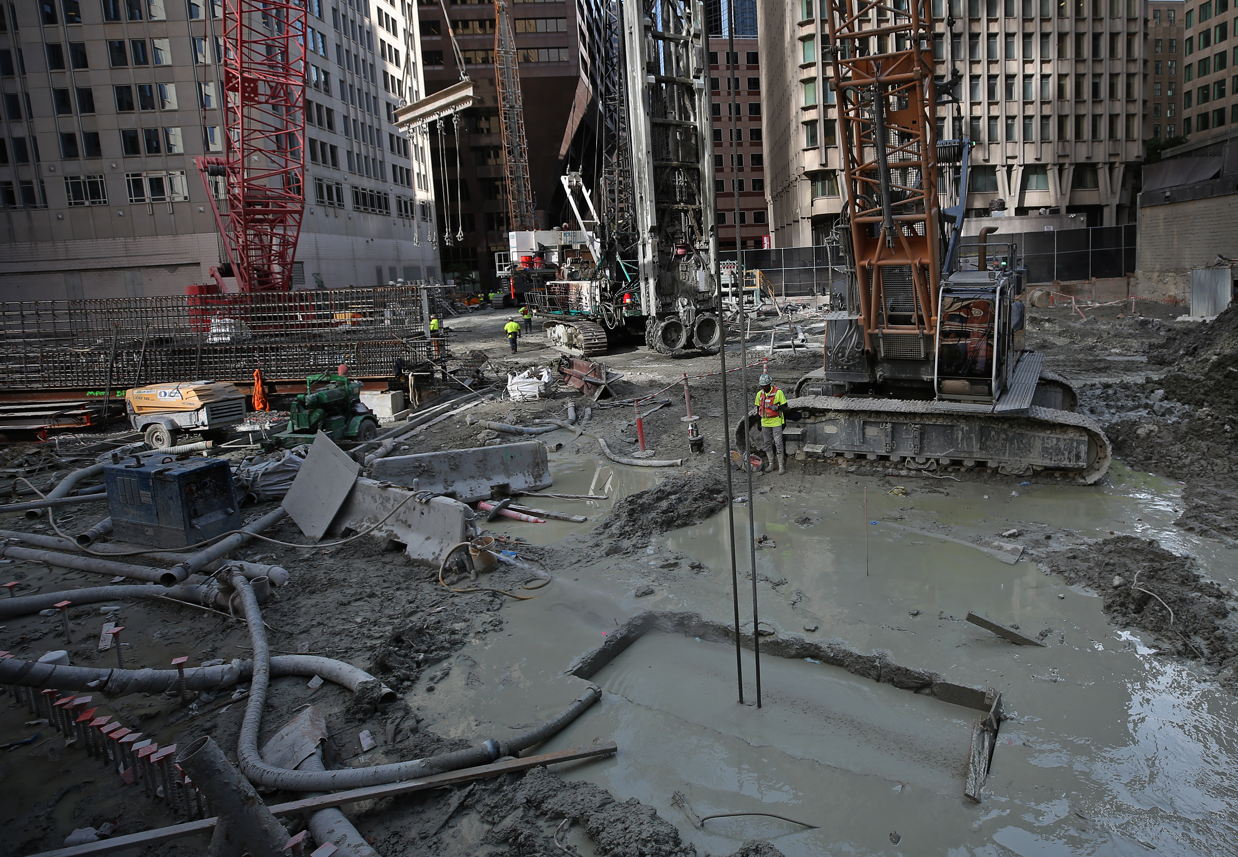 Mud and water among the machines at the Winthrop Square construction site.