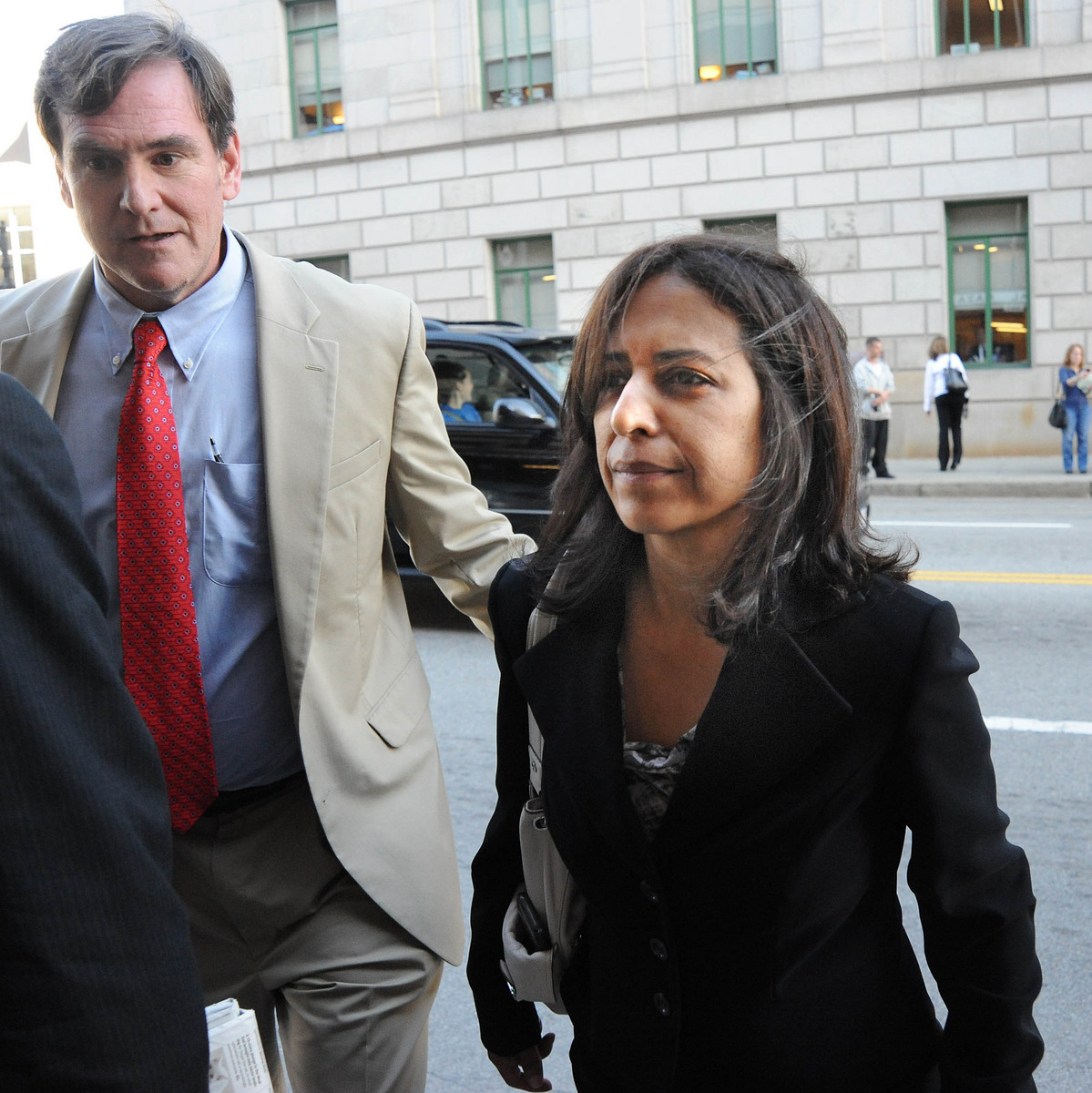 Elizabeth Tavares, right, left US District Court after she was arraigned in 2012 for alleged improper hiring practices at the Probation Department.