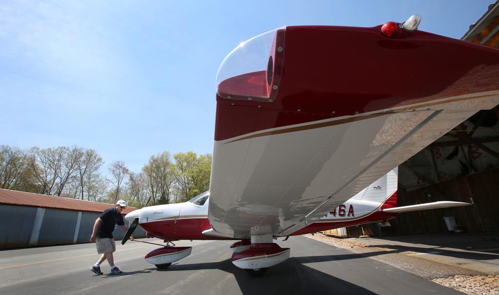 Jim Quinn of Canton pulls his Piper Archer II out of the hangar at the airport.
