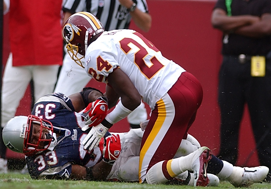 Kevin Faulk winced after cornerback Champ Bailey forced a fumble that the Redskins recovered on the one=yard line at the start of the third quarter at FedEx Field.