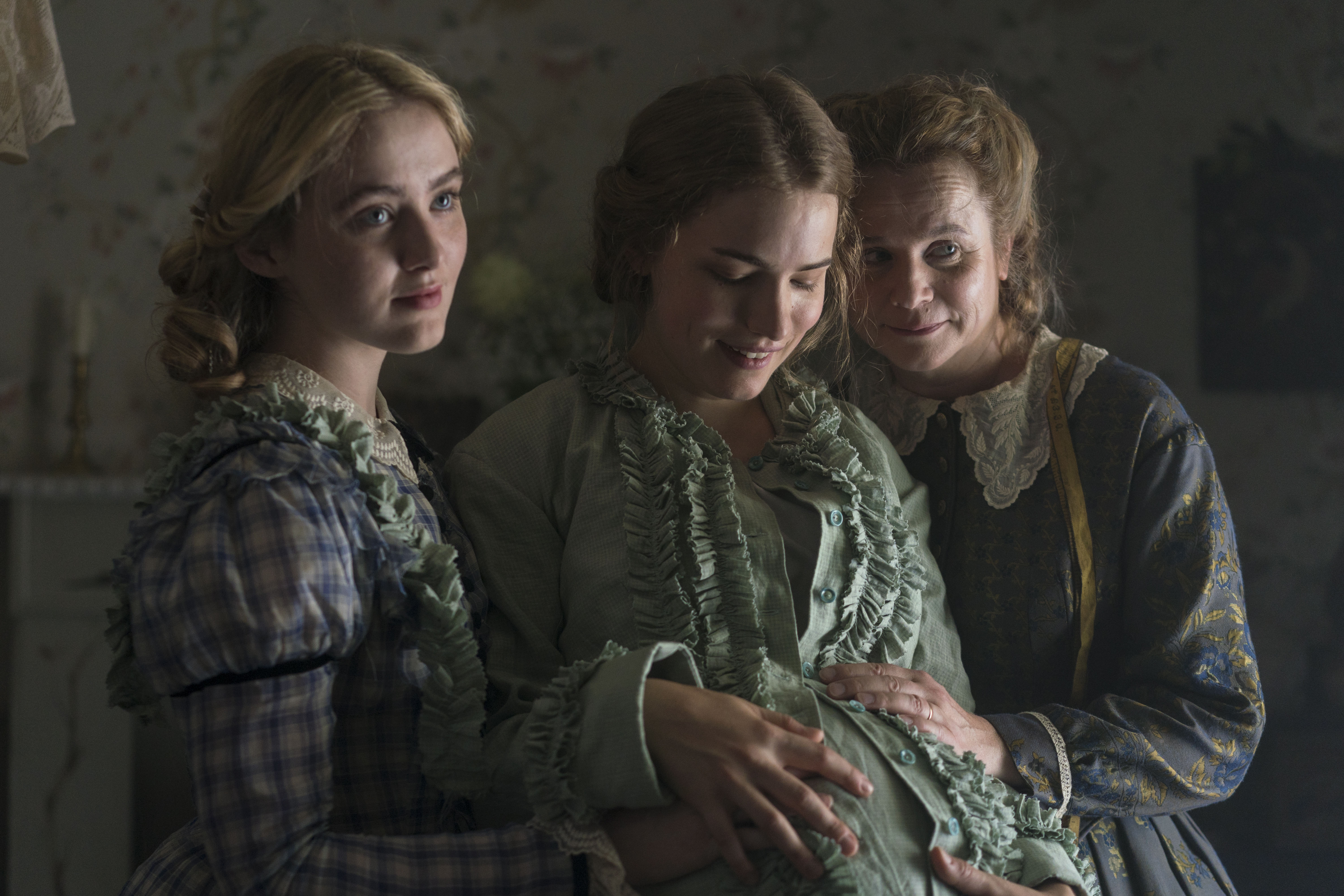 (From left) Kathryn Newton appears as Amy, Willa Fitzgerald as Meg, and Emily Watson as Marmee March in the 2018 three-episode television miniseries jointly produced by the BBC and PBS, which was set in Concord but