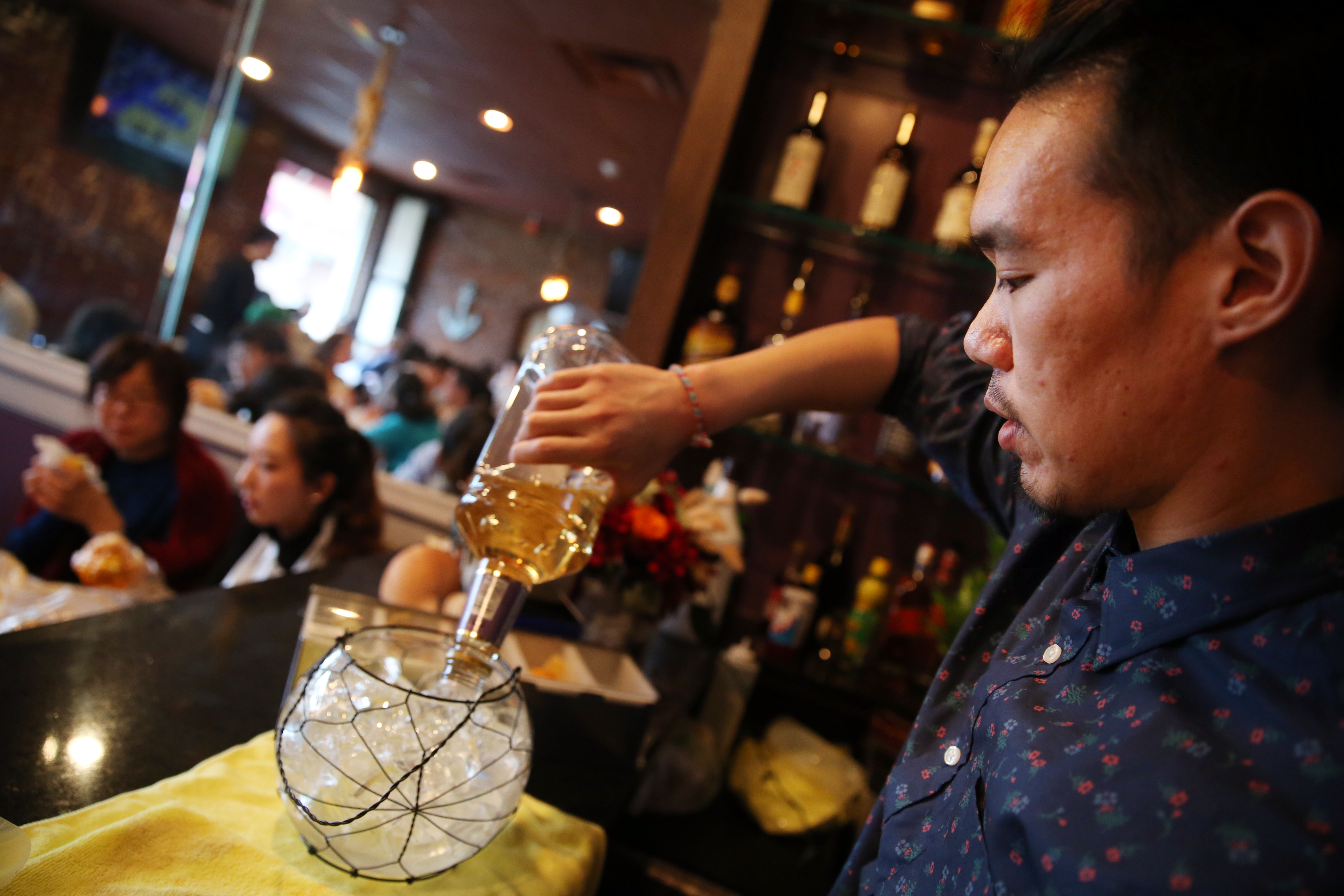 Owner Kevin Duong mixes one of the giddy drinks at Shaking Crab.
