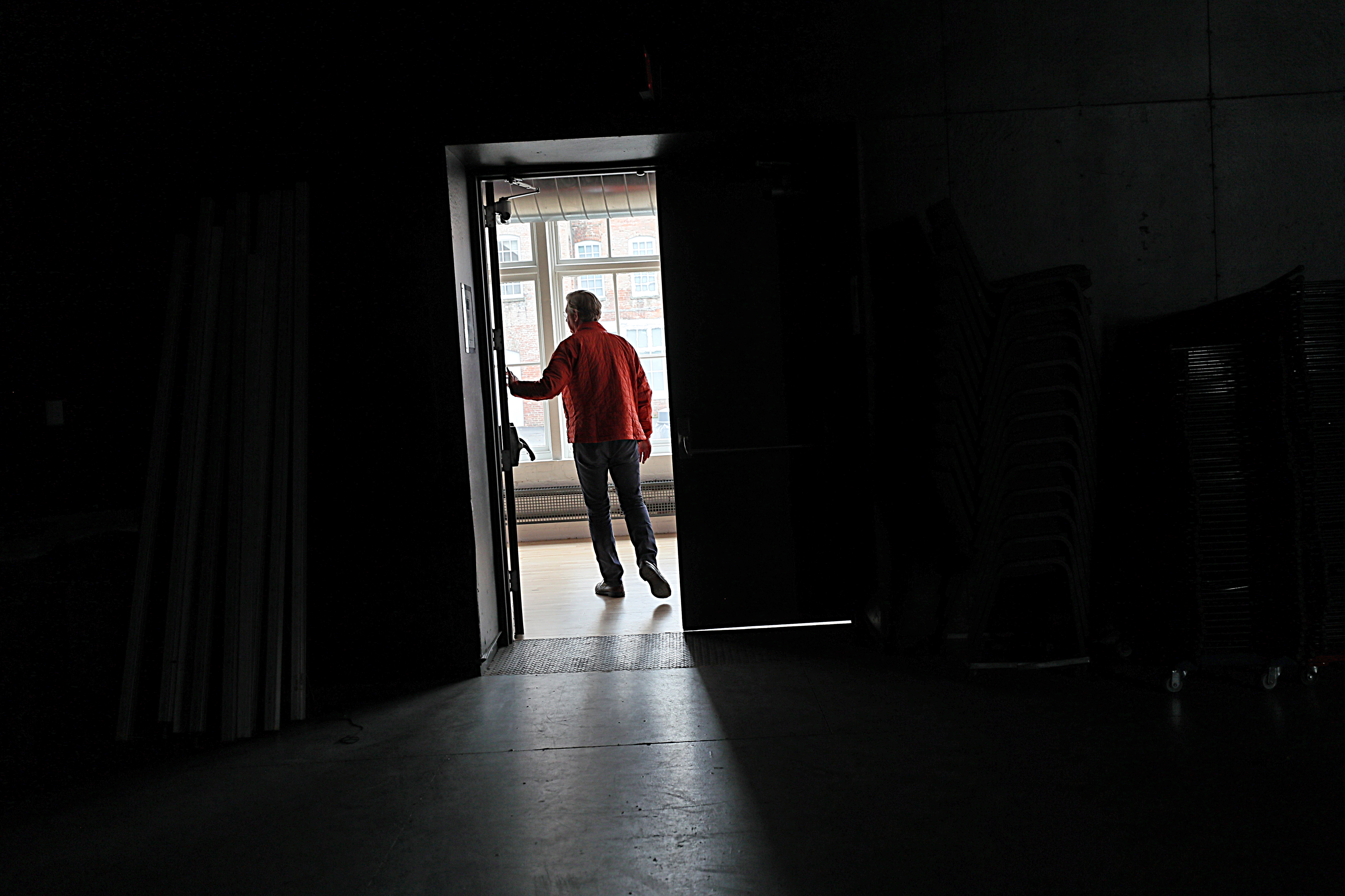 Mass MoCA director Joseph Thompson walks through one of the complex's empty buildings.