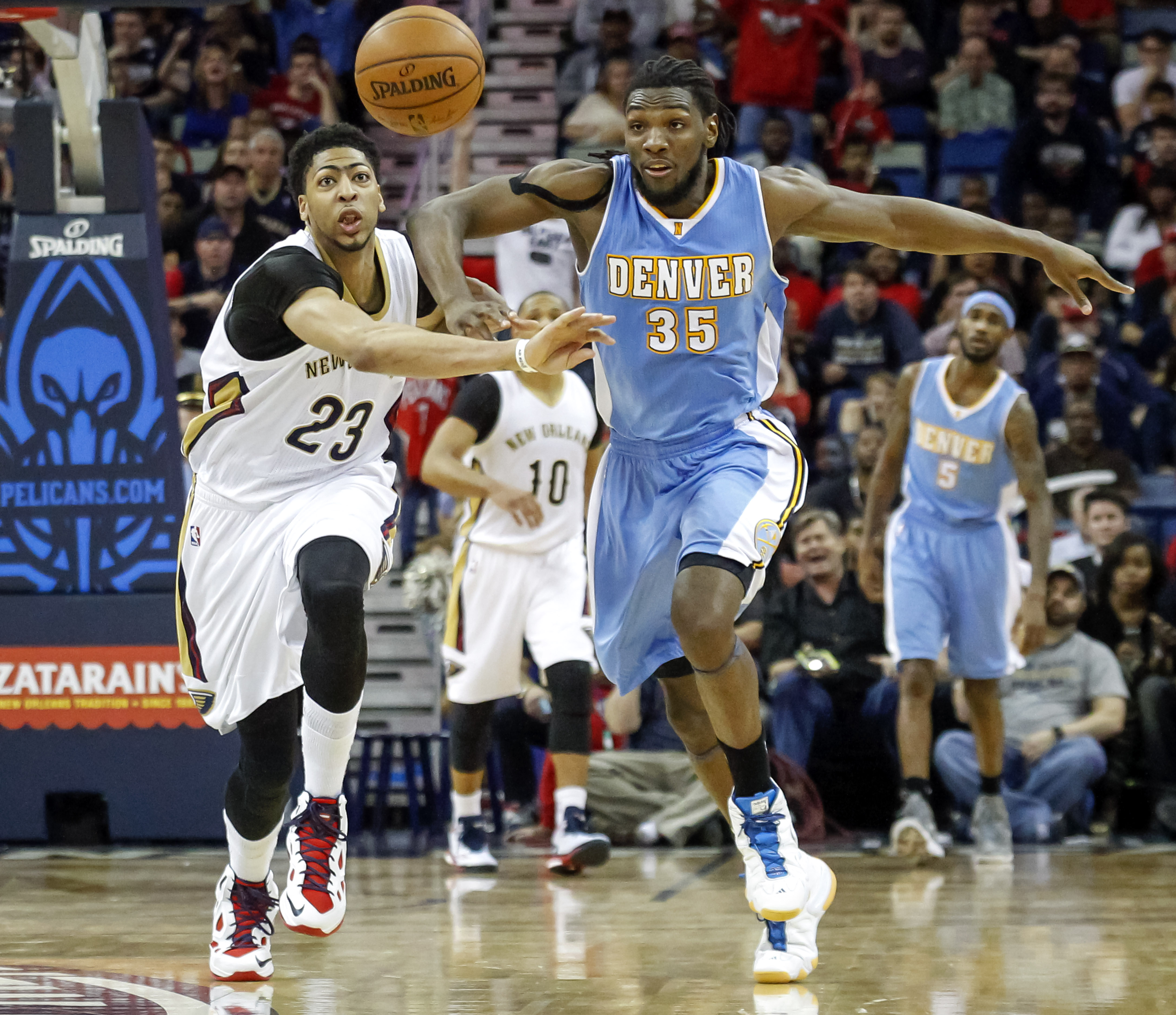 Anthony Davis (23) and Kenneth Faried were involved in two missed calls together in the Pelicans-Nuggets March 15 game.