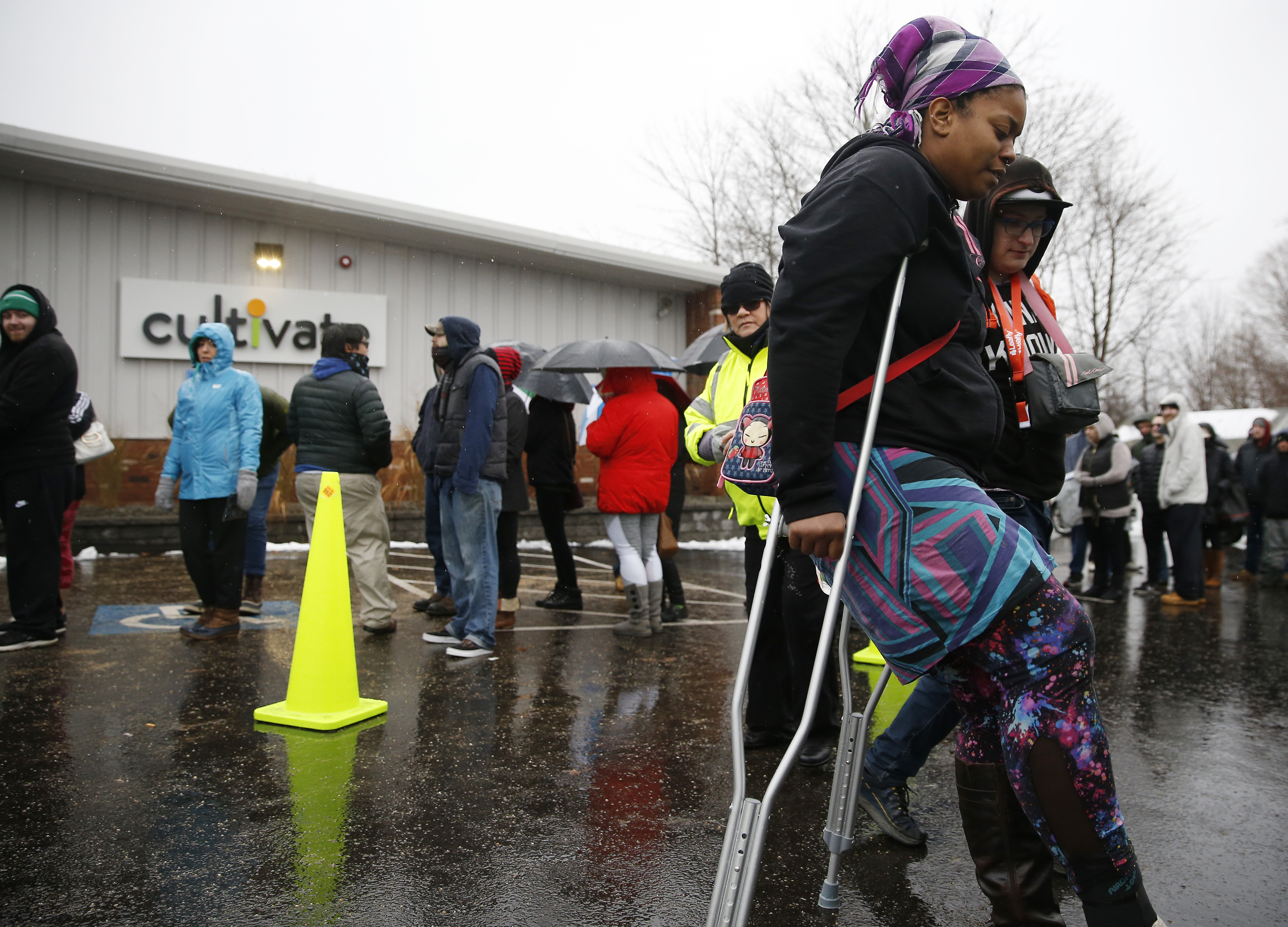 Boudicca Arieli of Somerdale, N.J. used crutches to make her way back to the shuttle after purchasing marijuana .
