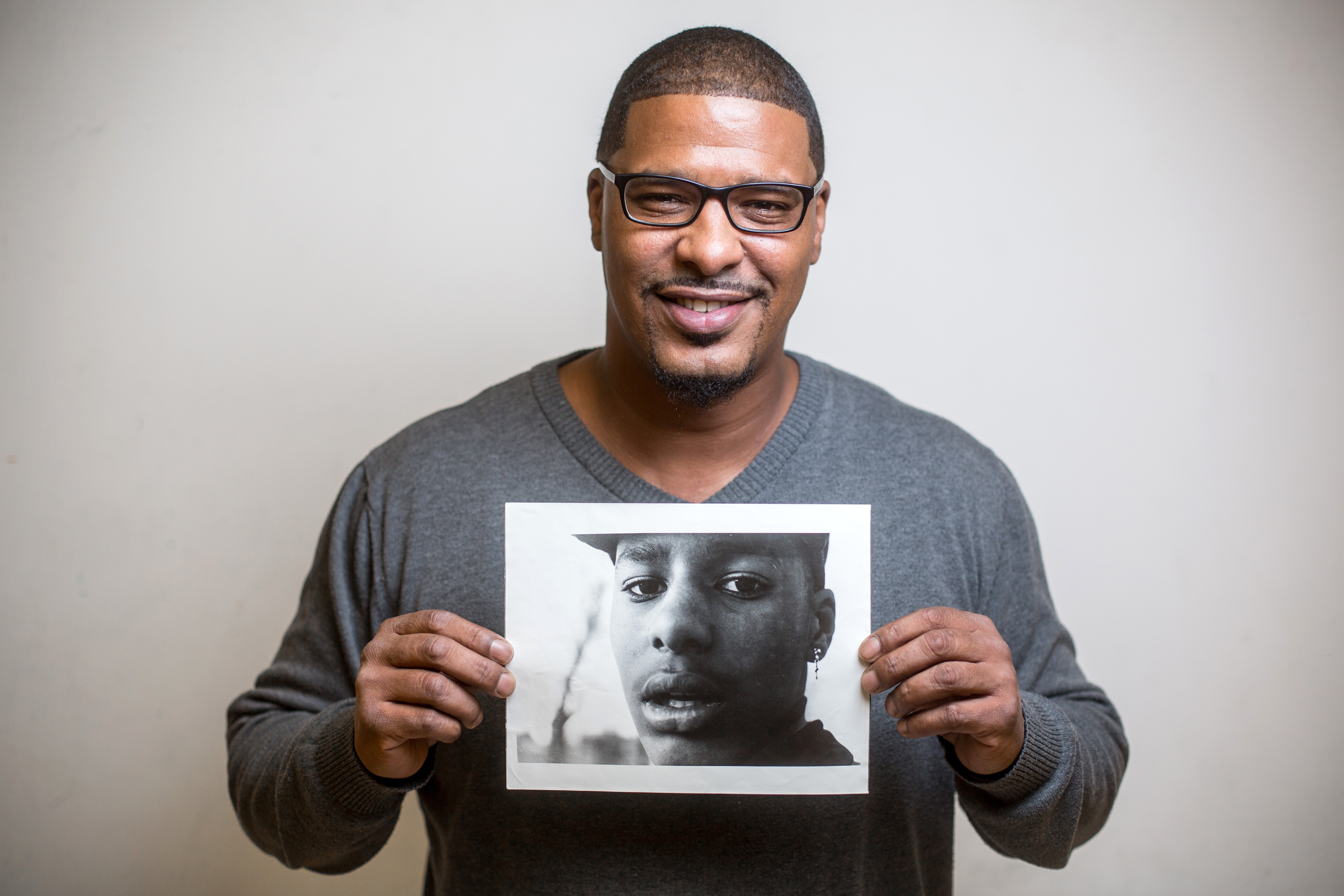 Dean Headley with a photo of himself from around 1986.