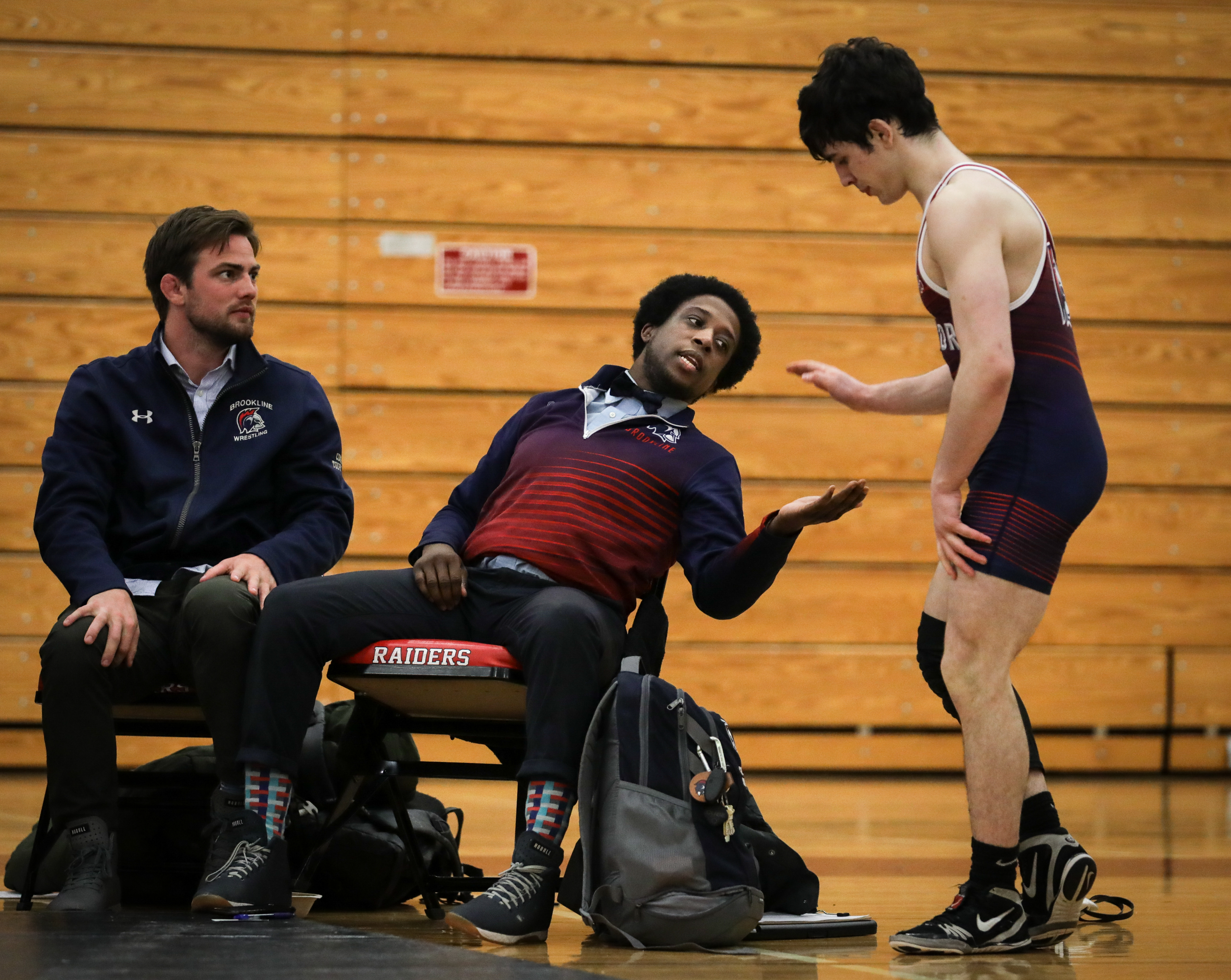Brookline head coach Trevour Smith had some encouragement for Luke Albanese after another win at 132 pounds.