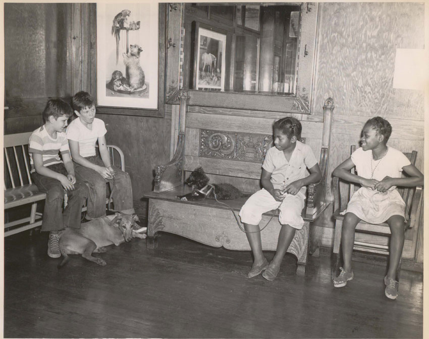 Dogs and children wait in the hospital lobby.