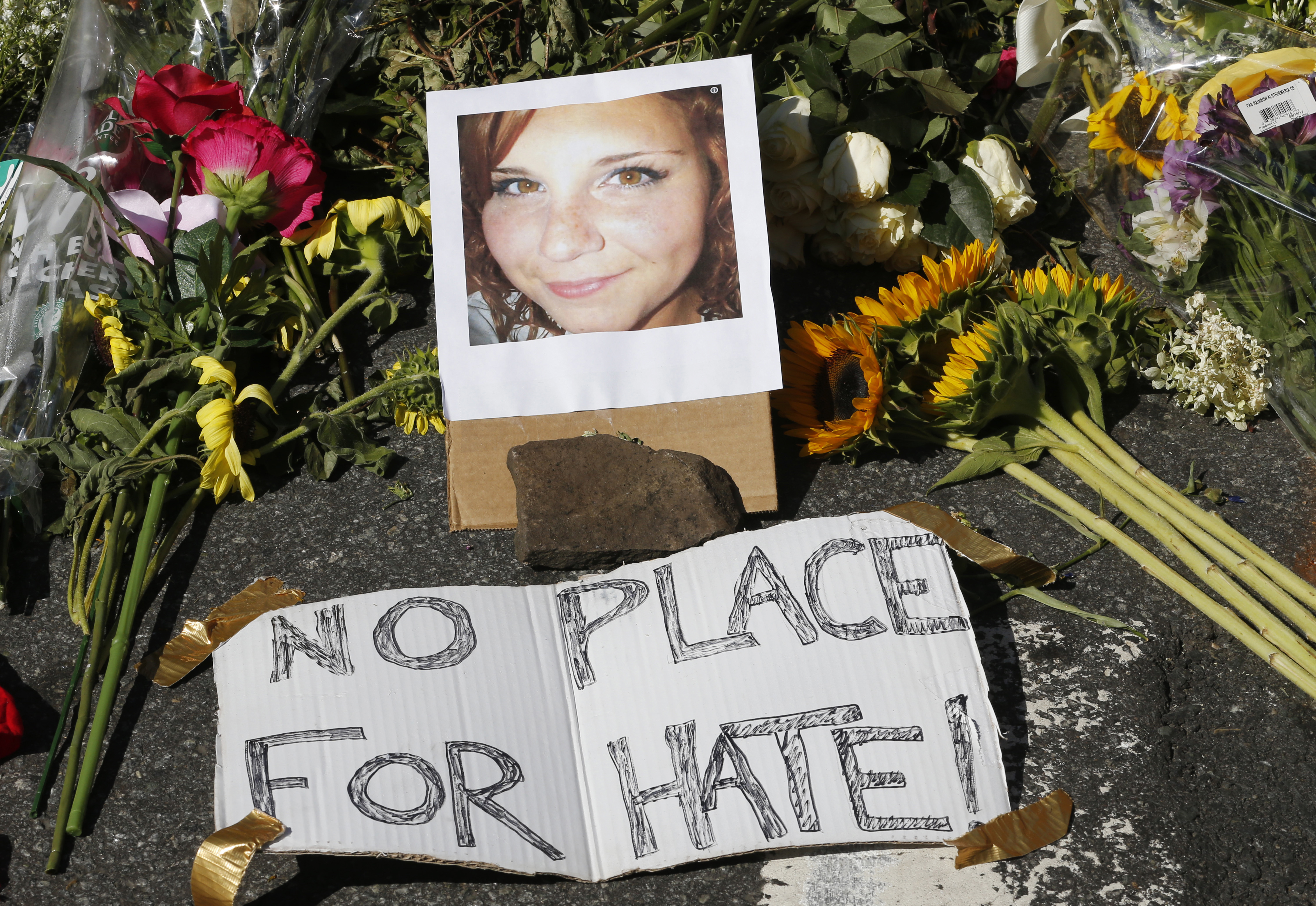 A makeshift memorial of flowers and a photo of Heather Heyer, who was killed when a car rammed into a group of people who were protesting the presence of white supremacists who had gathered in Charlottesville, Va., in August.