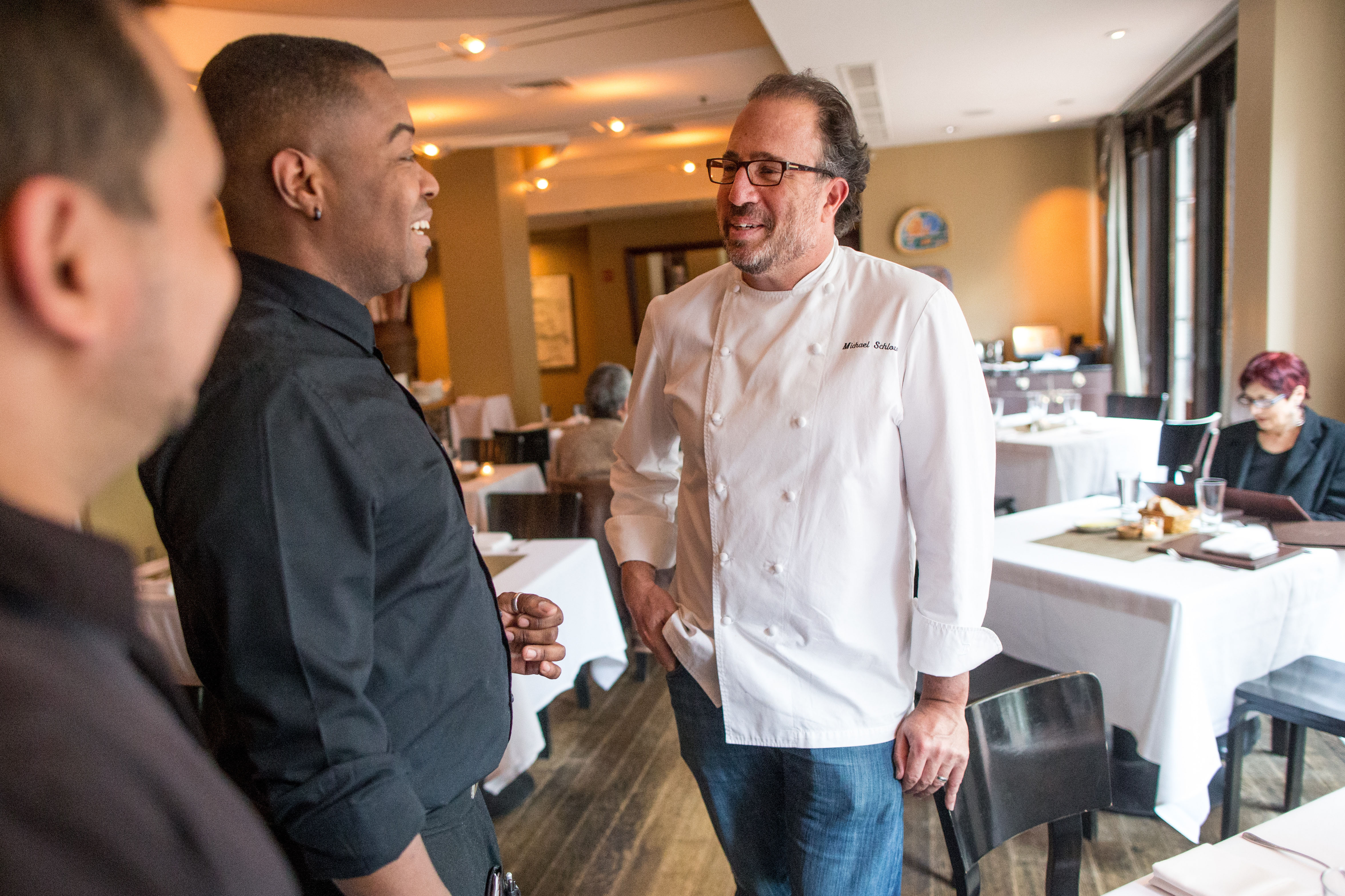 Via Matta chef/owner Michael Schlow spoke with servers Dennis Ochao (left) and Curtis Alford in the restaurant’s dining room.
