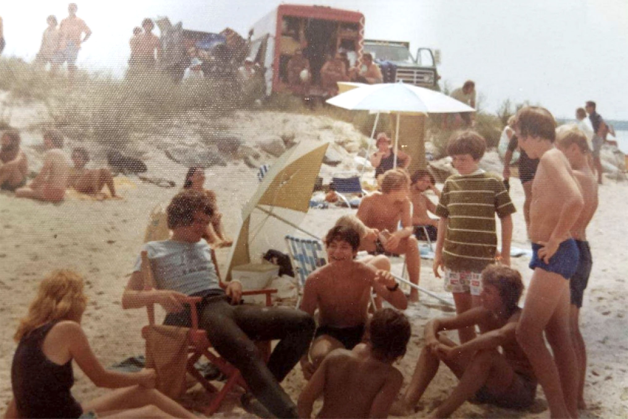 A photo of people gathered around director Steven Spielberg on the “Jaws” set.