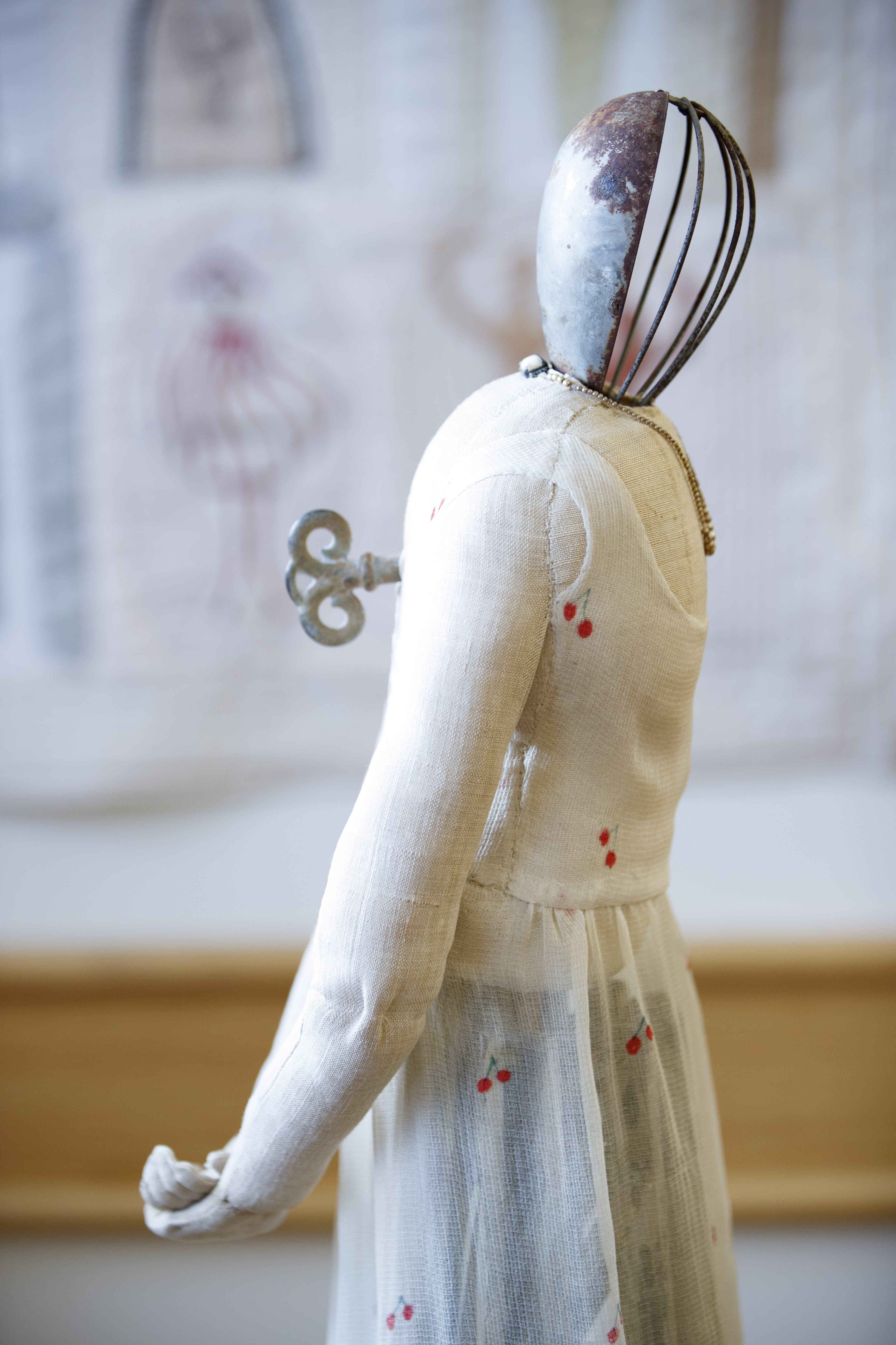 This work by Lorraine Sullivan is titled “Mother in Her Cherry Dress.”