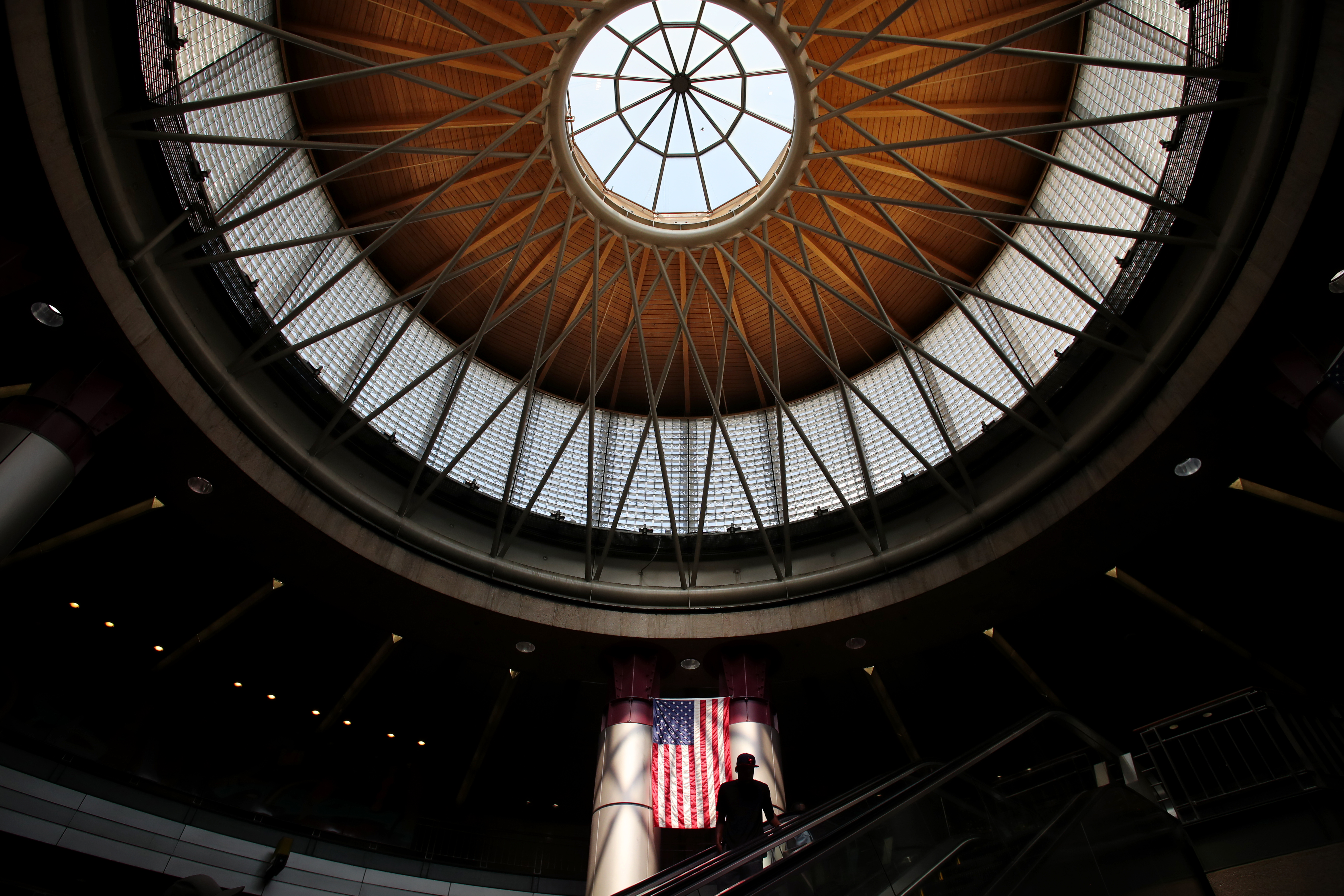 A man ascended an escalator at the South Station bus terminal.