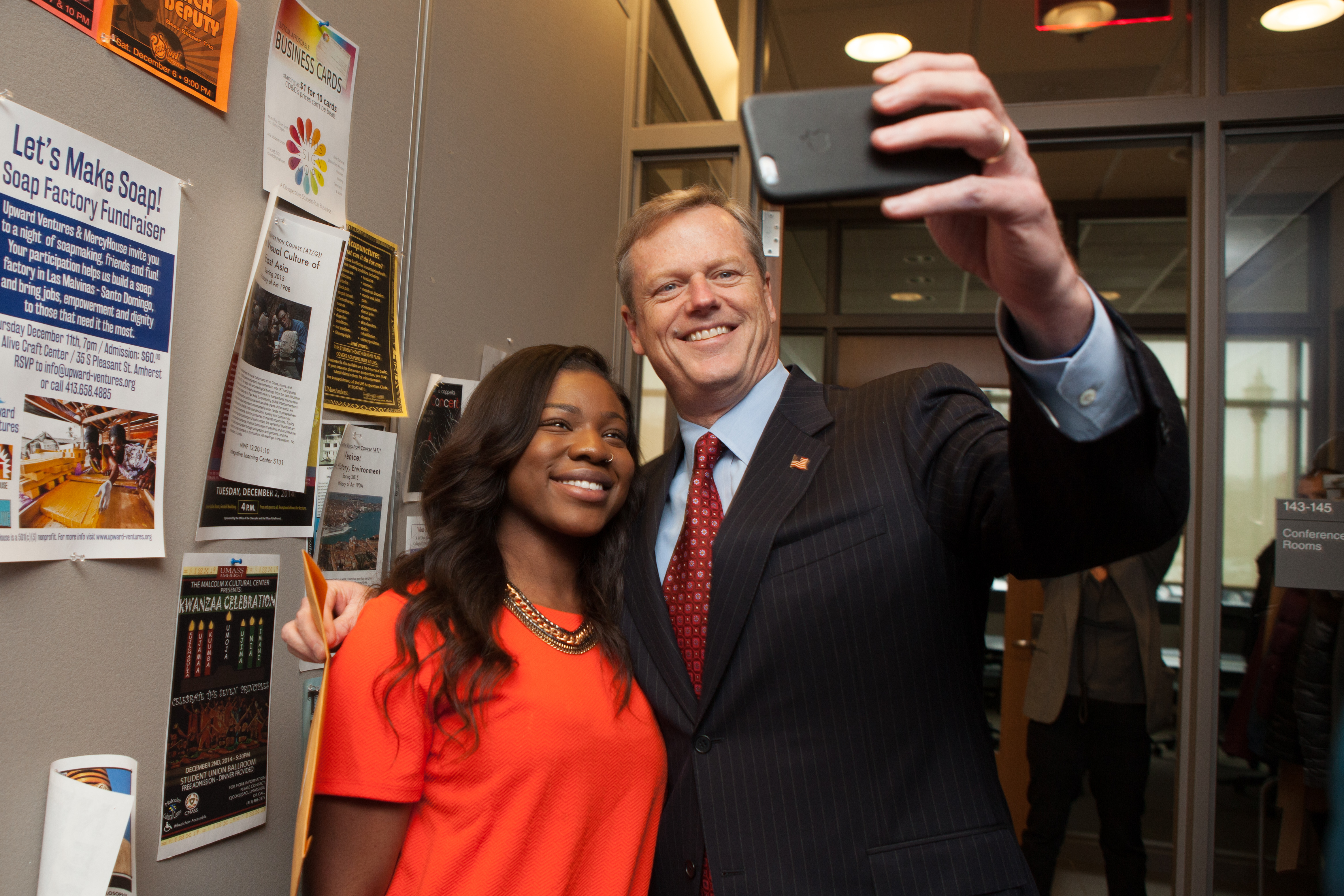 Mass. Gov. Elect Charlie Baker took a selfie with UMass Amherst senior Patrice Charlot of Brockton during a visit to the Western Mass campus.