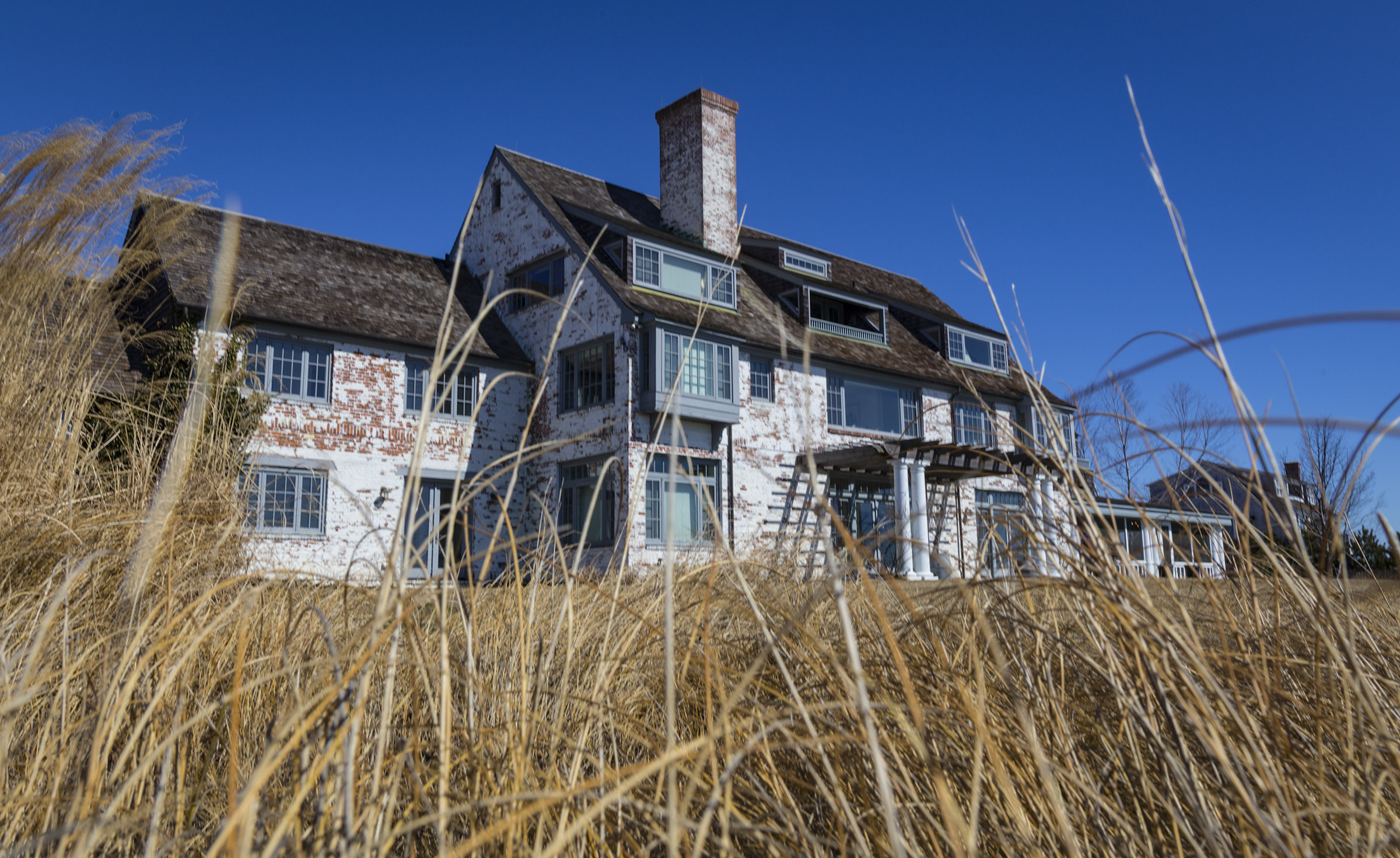 A front view of the home, which faces Long Island Sound. The property has 220 feet of waterfront and a private dock.
