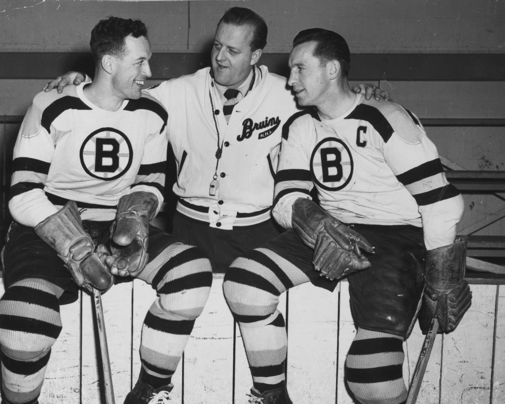 Milt Schmidt (right) in an undated photo with Bruins teammate Hal Laycoe (left) and coach Lynn Patrick.