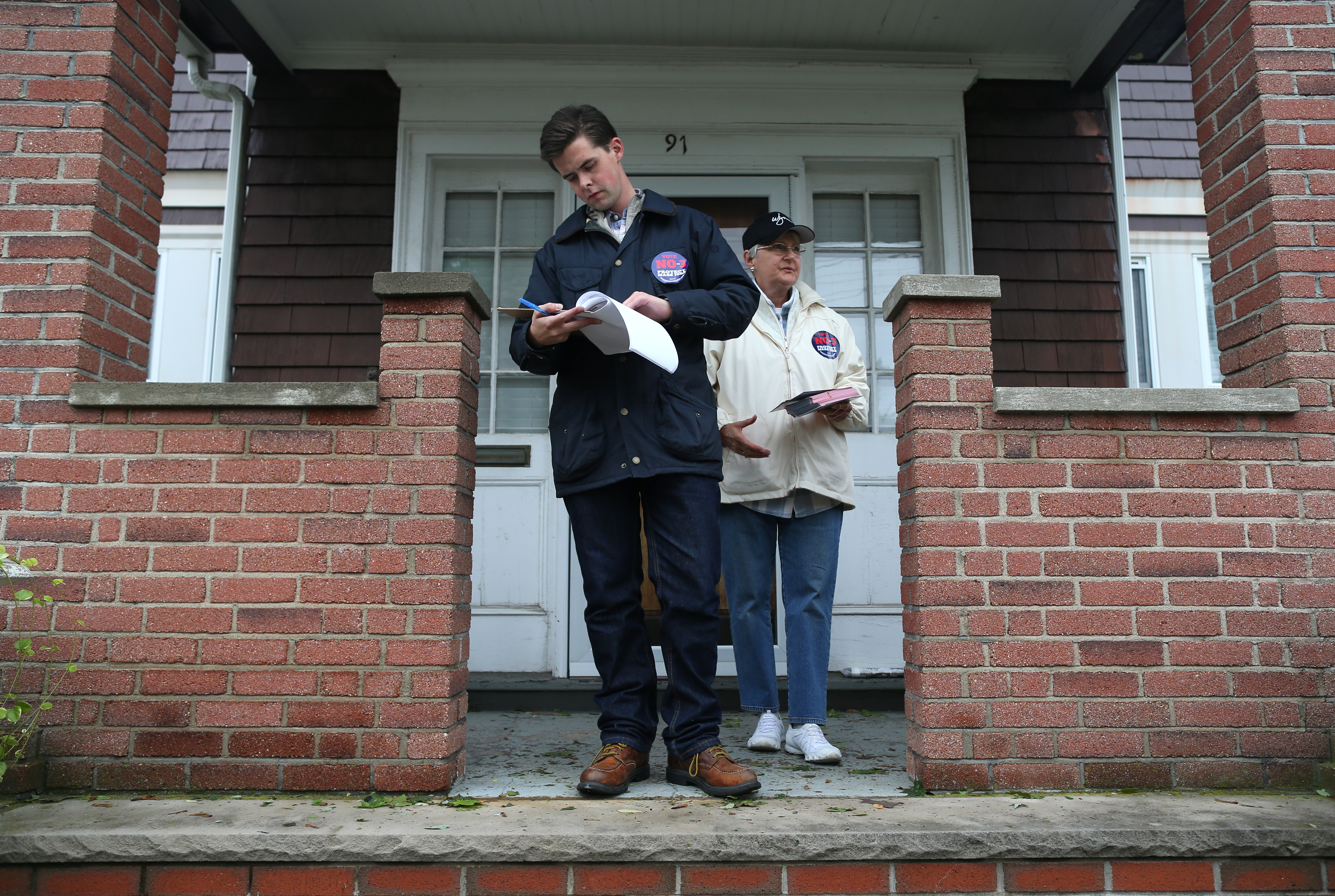 Ryan Holmes and LouAnne Zawodny canvassed in Chelsea to encourage voters to oppose the referendum.