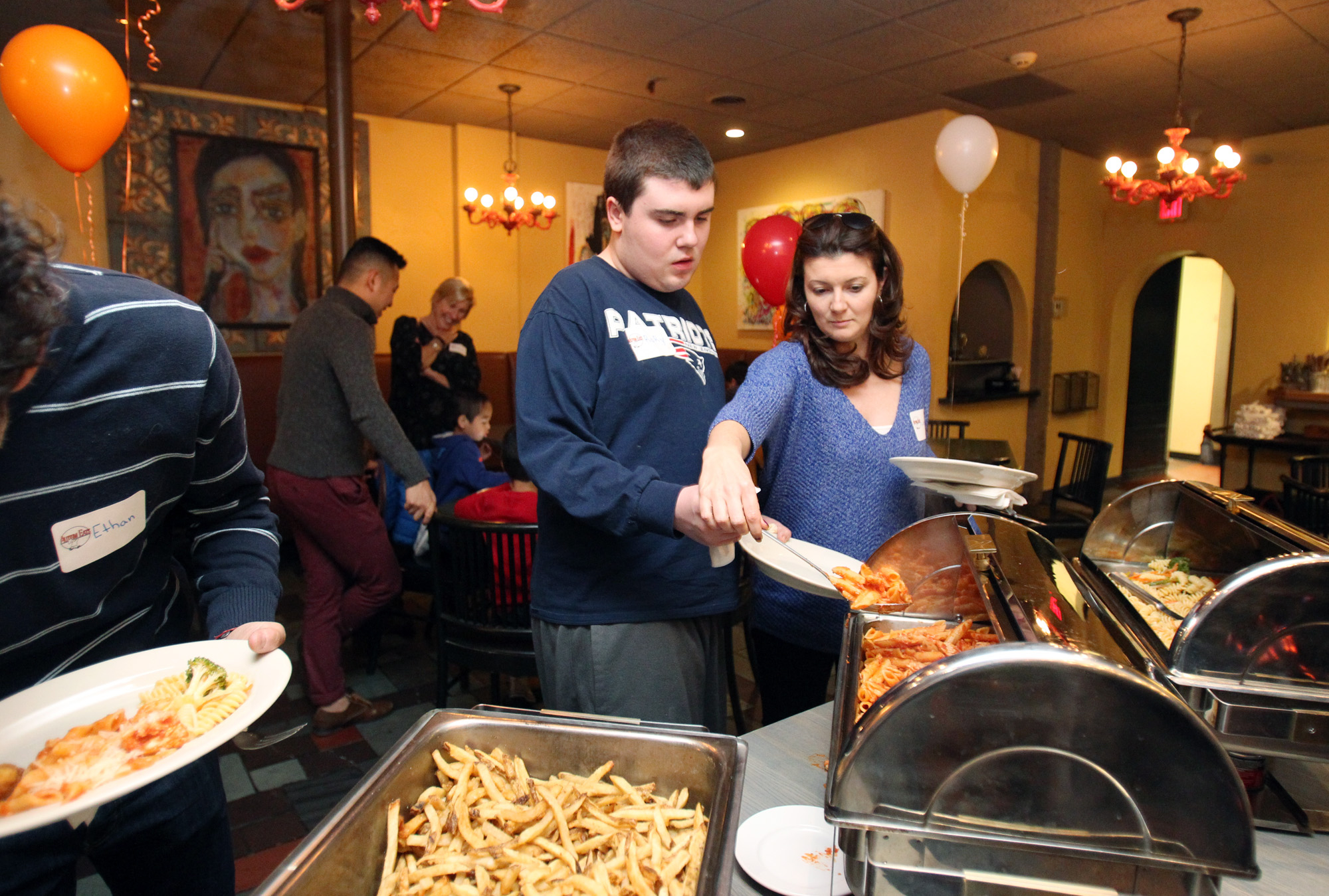 LeeAnn Mahoney helped Rory Callahan on the buffet line.