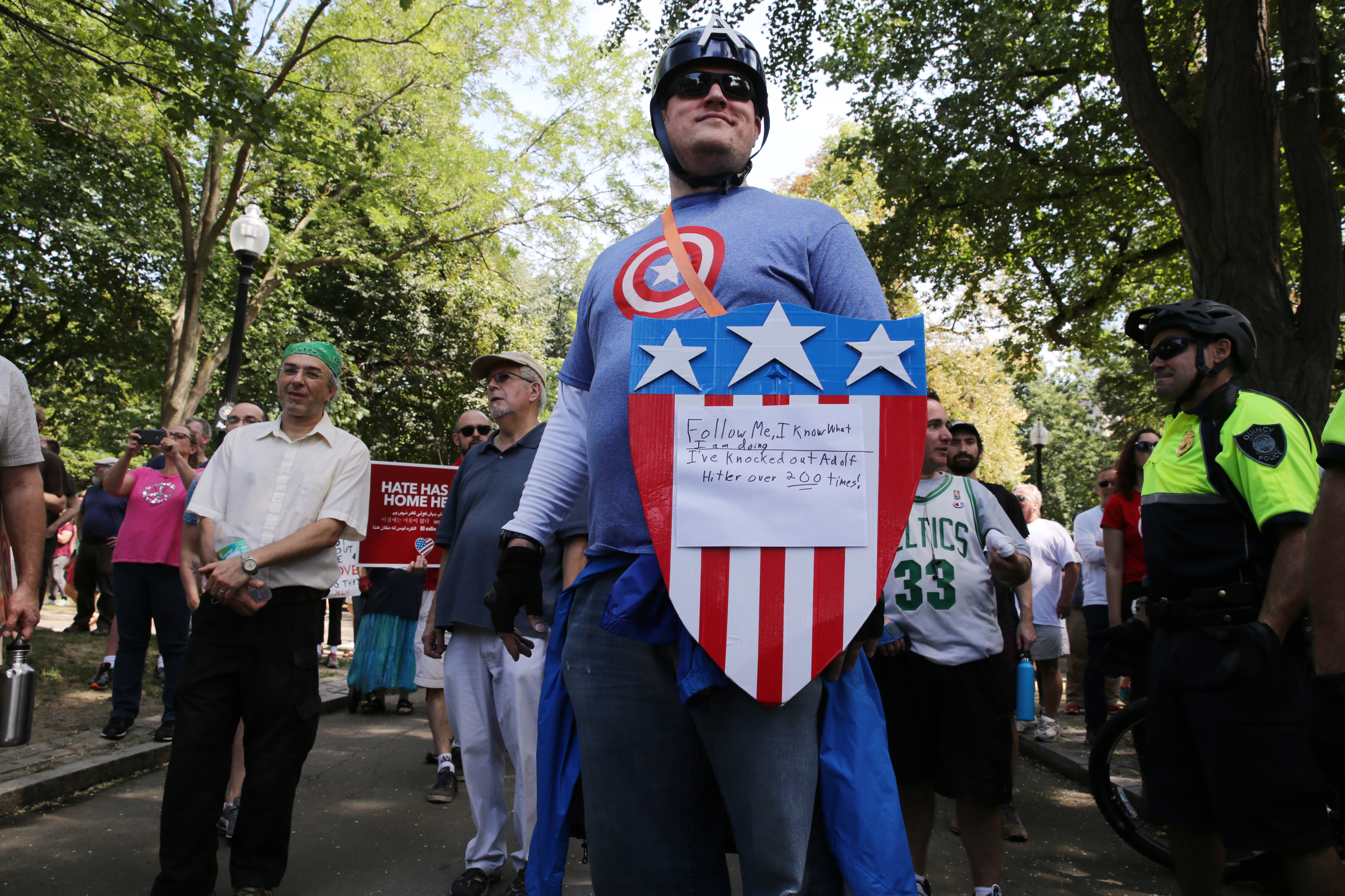 A man dressed as Captain America protested the “free speech” rally.