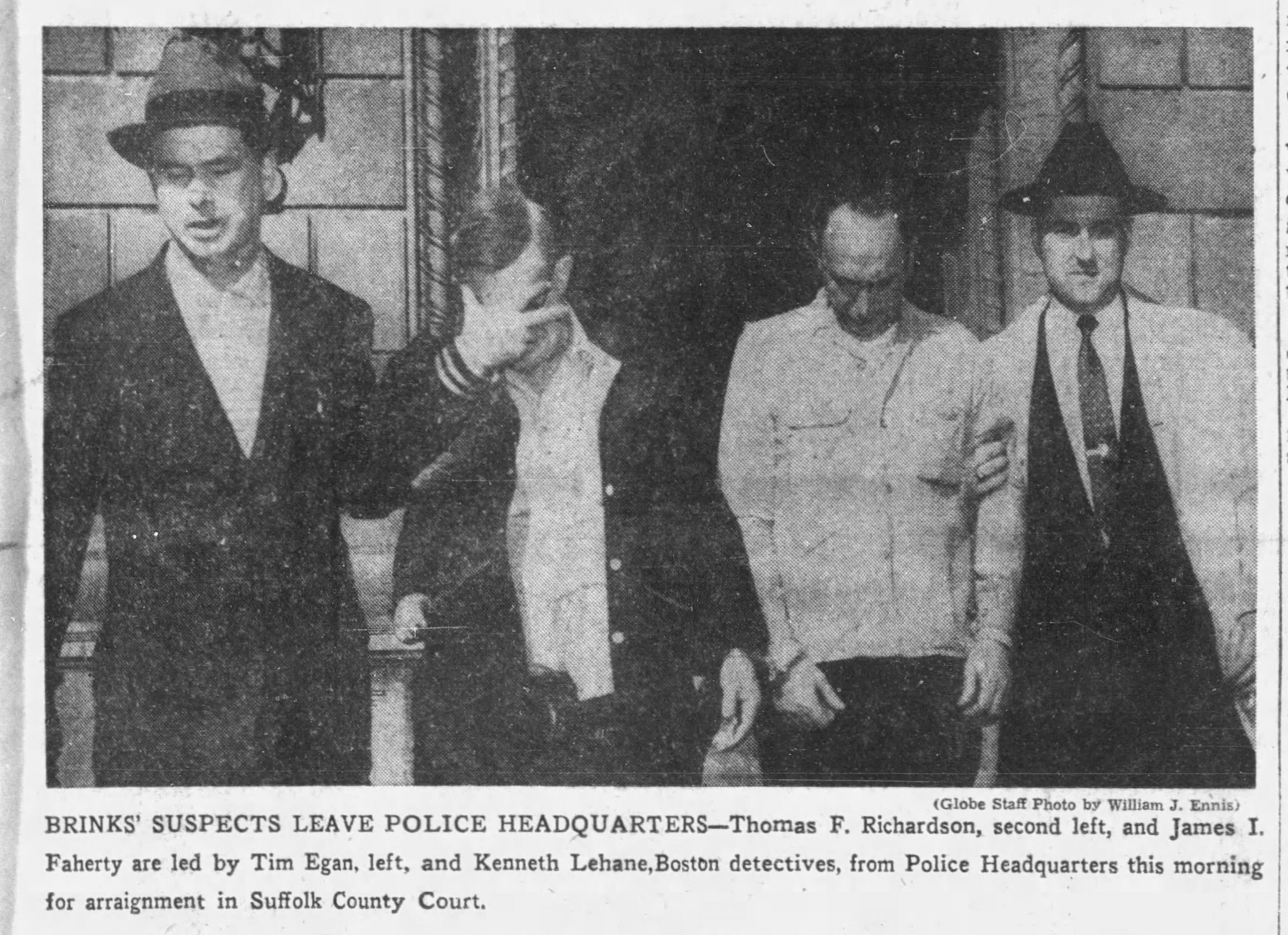 Brink's suspects Thomas F. "Sandy" Richardson and "James Faherty were photographed leaving police headquarters after they were captured in May 1956. (Boston Globe Archive)