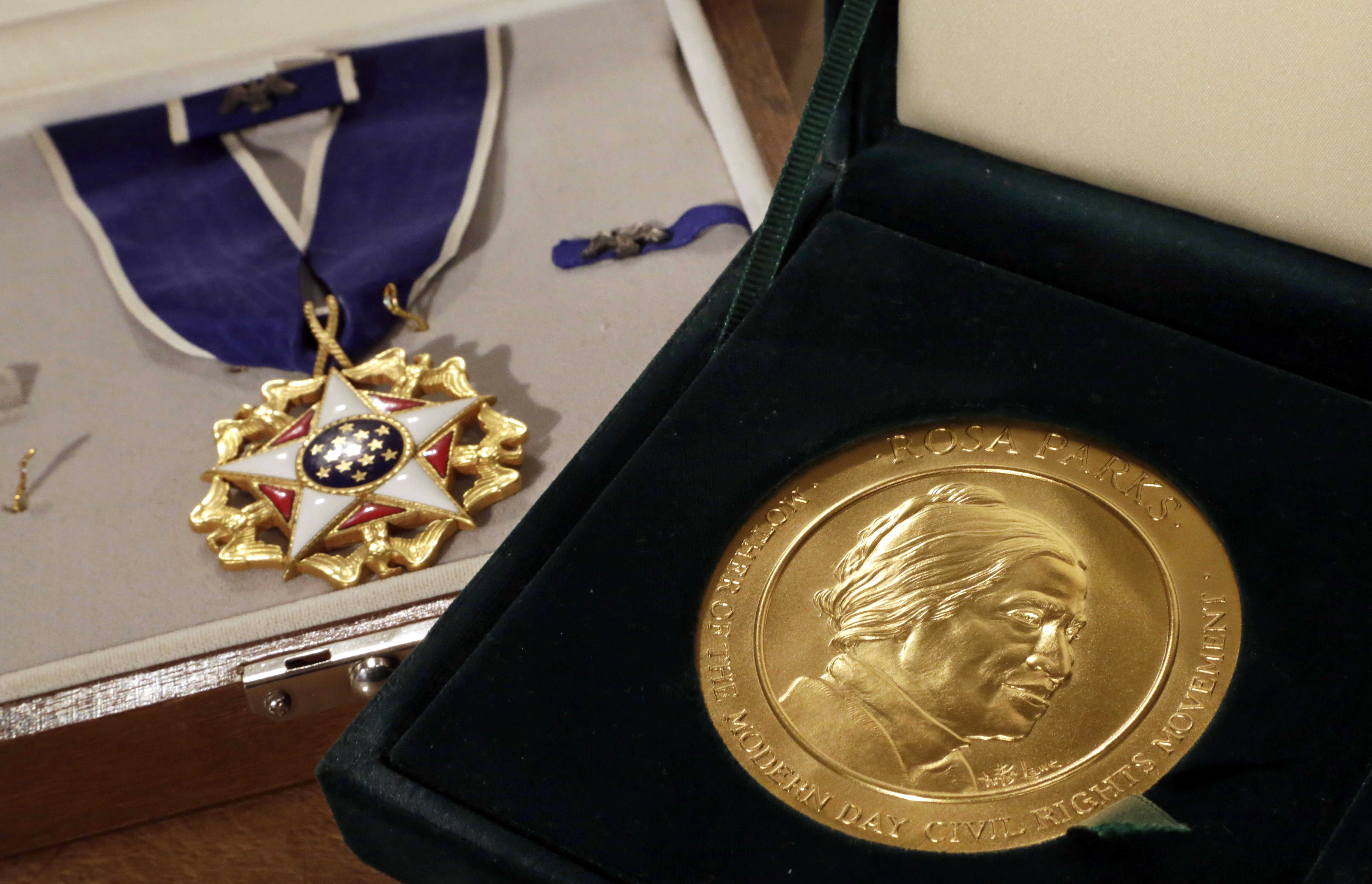 Parks' Presidential Medal of Freedom (left) and her Congressional Gold Medal will be offered up to the highest bidder.
