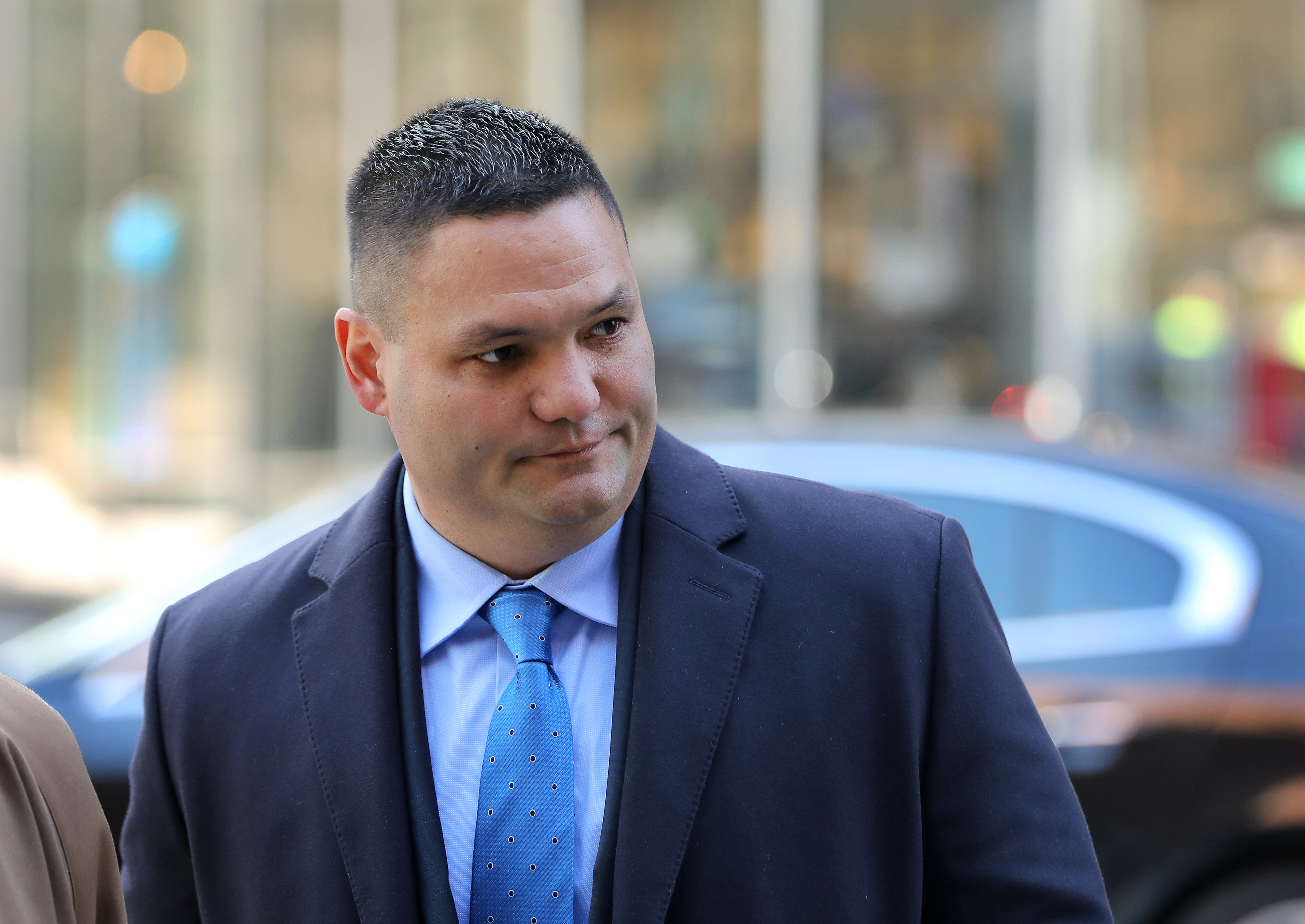 Former trooper Eric Chin pleaded guilty in federal court to an embezzlement charge. Above: Chin left federal court in March.