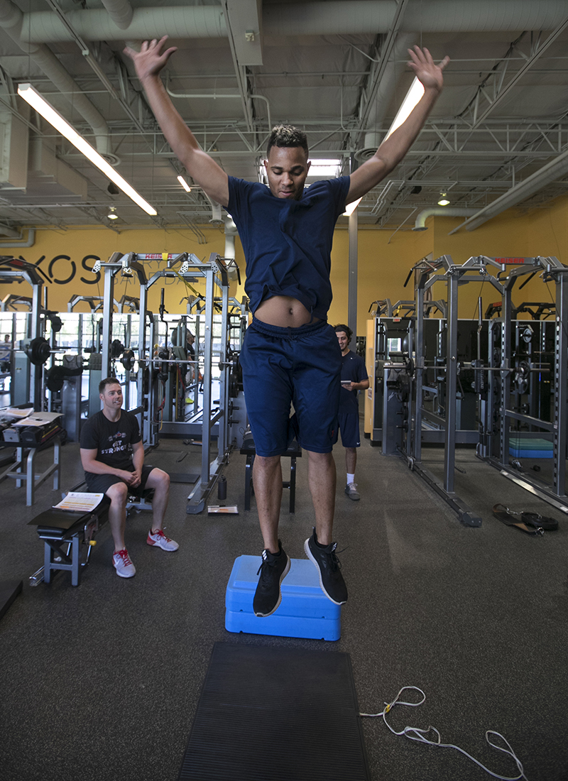 Measuring his jump.