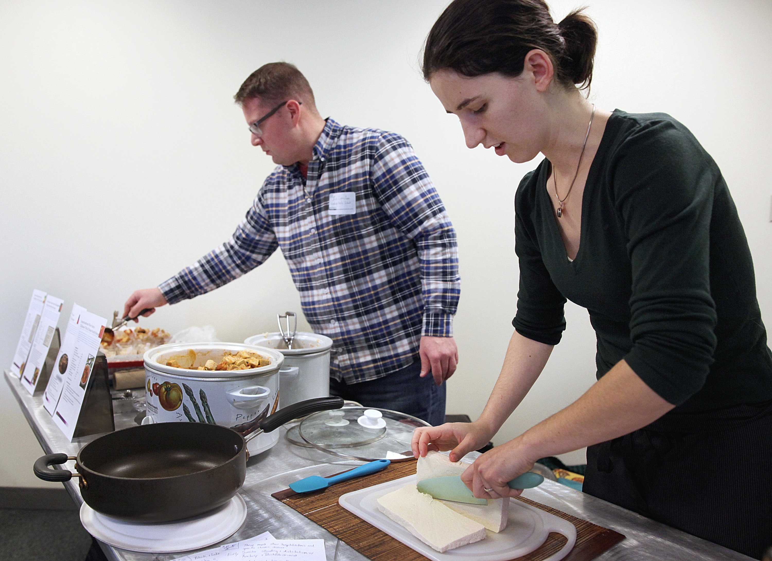 At College of the Holy Cross, Ian Lavallee and Melissa Honeywood of Cambridge Public Schools made a stir-fried tofu and tomato dish.