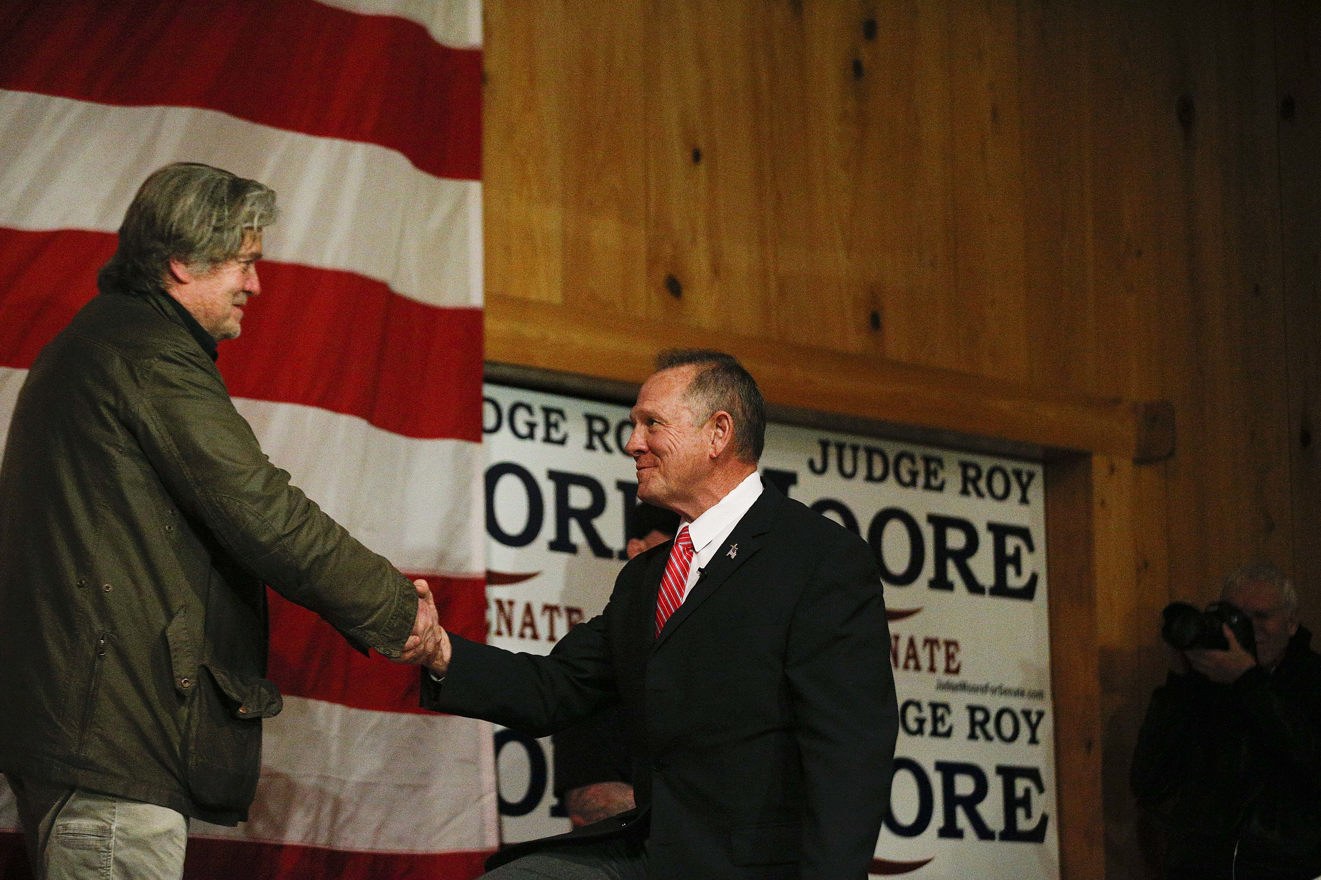 Steve Bannon (left) introduced Roy Moore during a campaign rally.