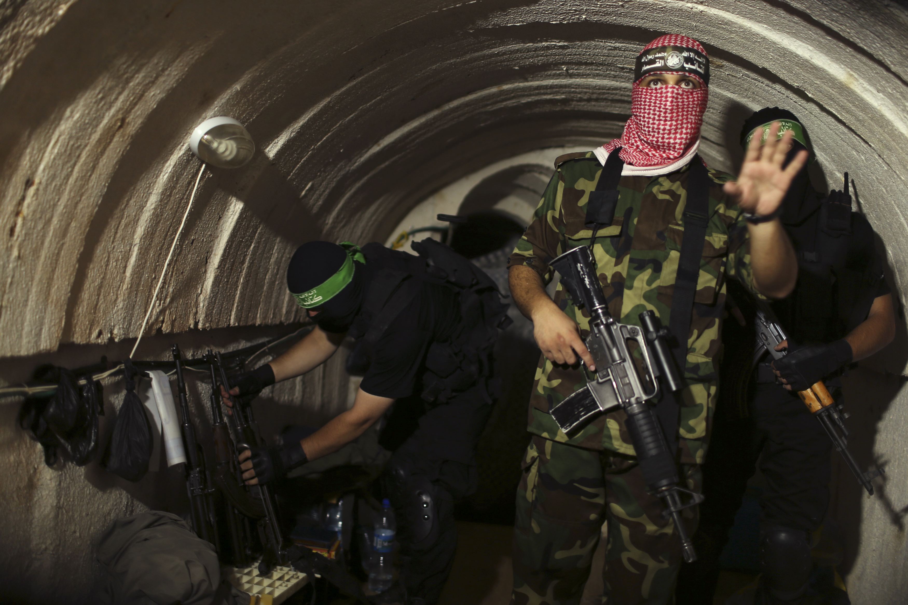 A Palestinian fighter from the armed wing of Hamas gestures inside an underground tunnel in Gaza Aug. 18.