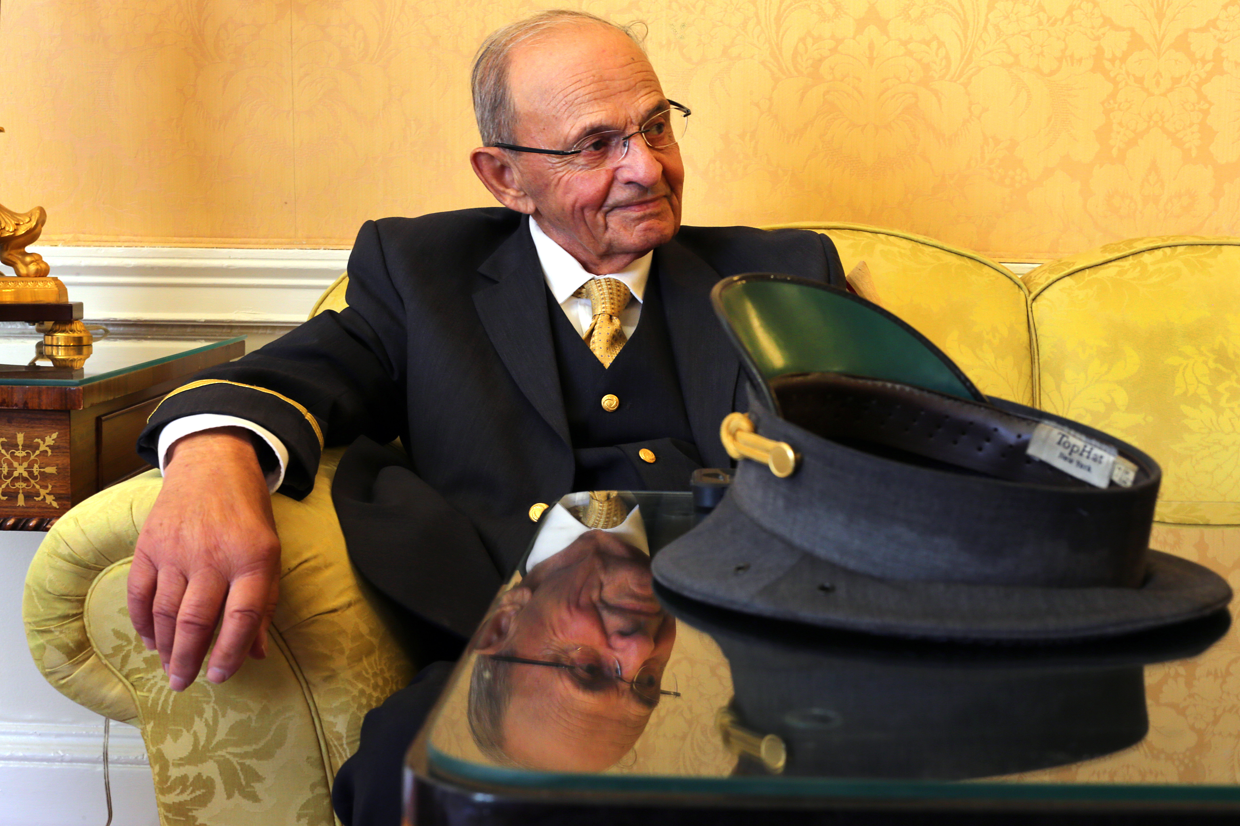 Norman Pashoian took a break Wednesday. He said he went through more than a dozen hats during his career.