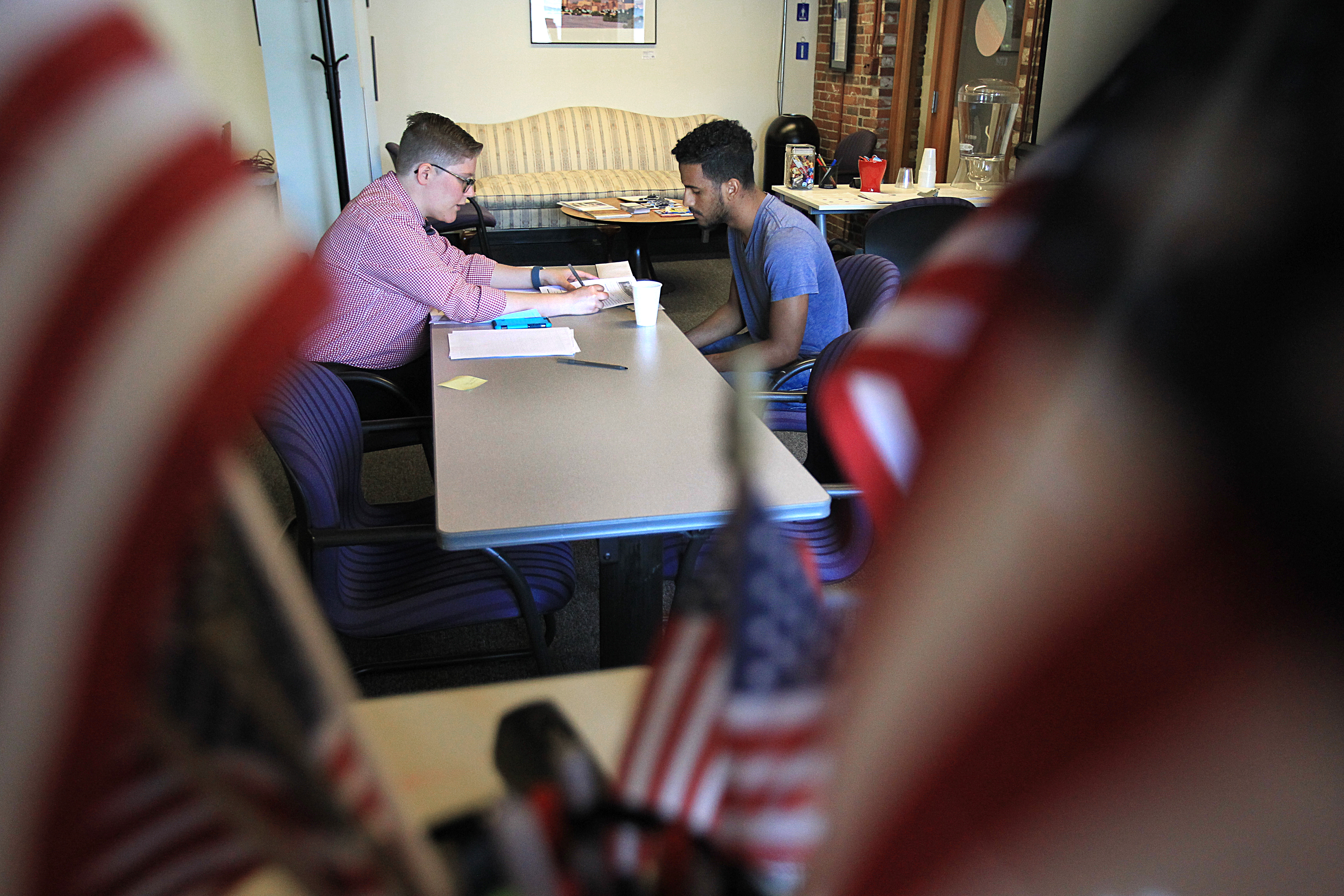 At Project Citizenship, Katie Lambing, Americorps Citizenship attorney helps hector Guerrero apply for citizenship.