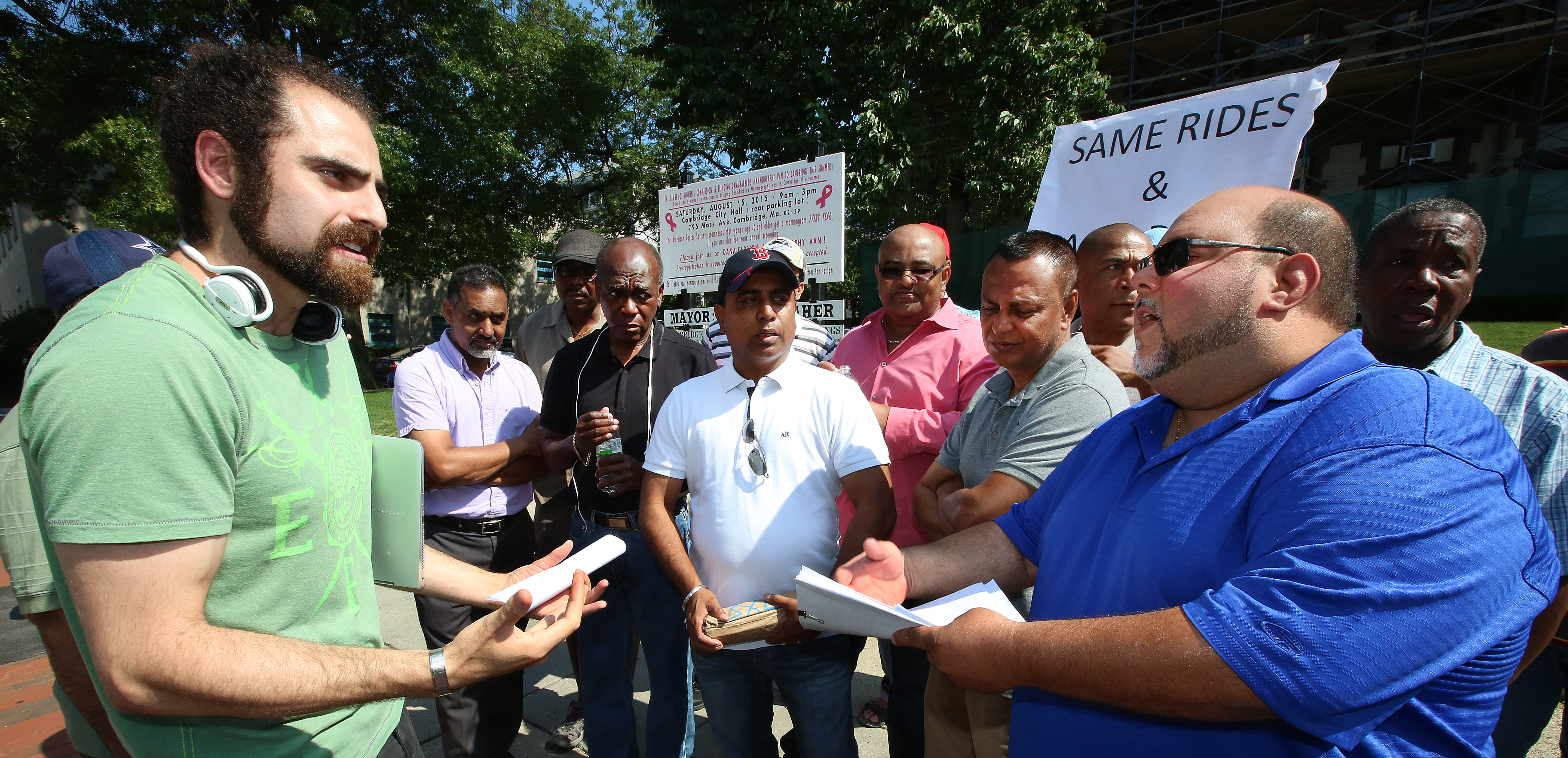 Cambridge City Councilor Nadeem Mazen (left) and Nelson Hernandez, a spokesman for Cambridge taxi drivers, stated their positions.