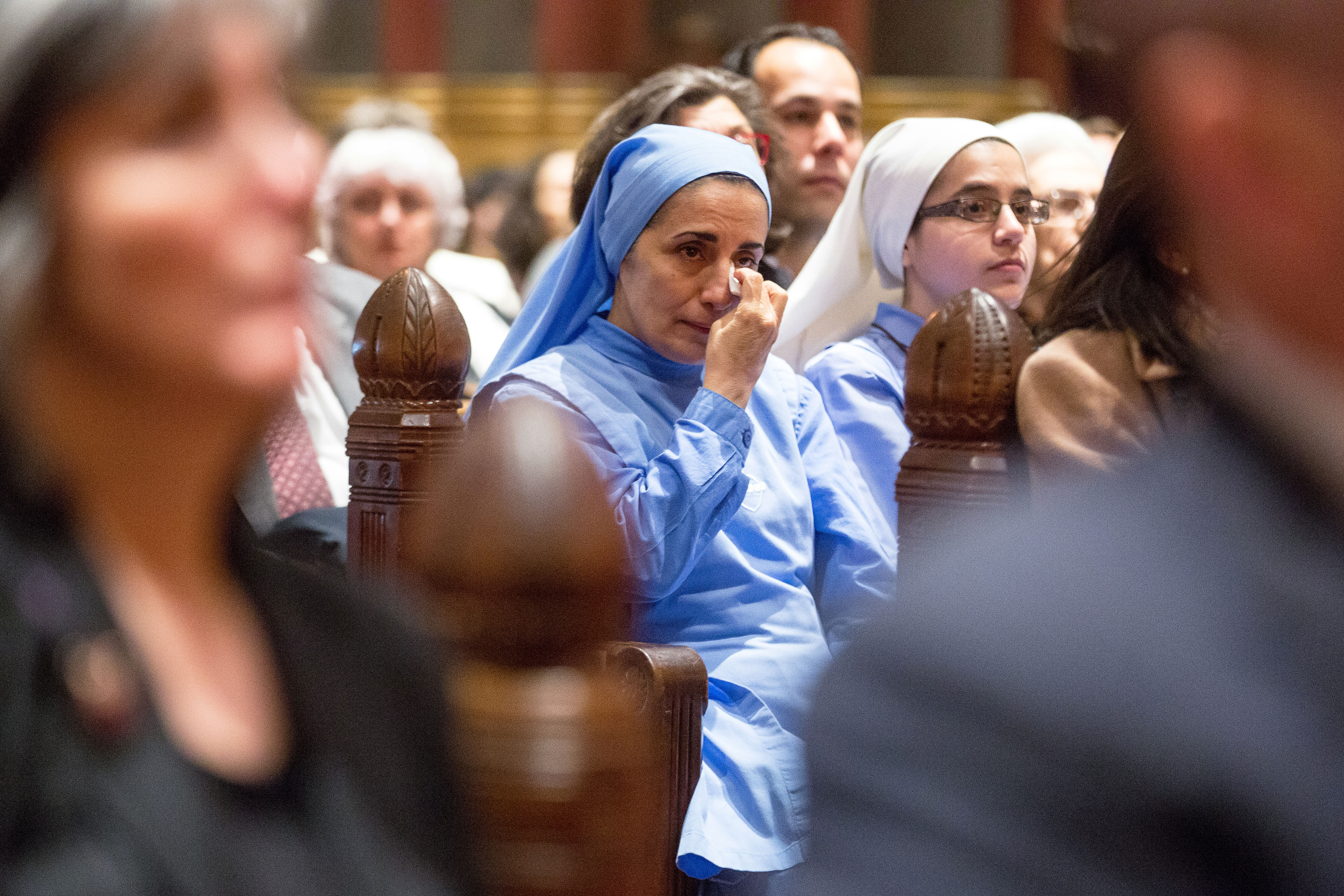 A woman wiped away tears at a service at Trinity Church in Boston on Thursday.