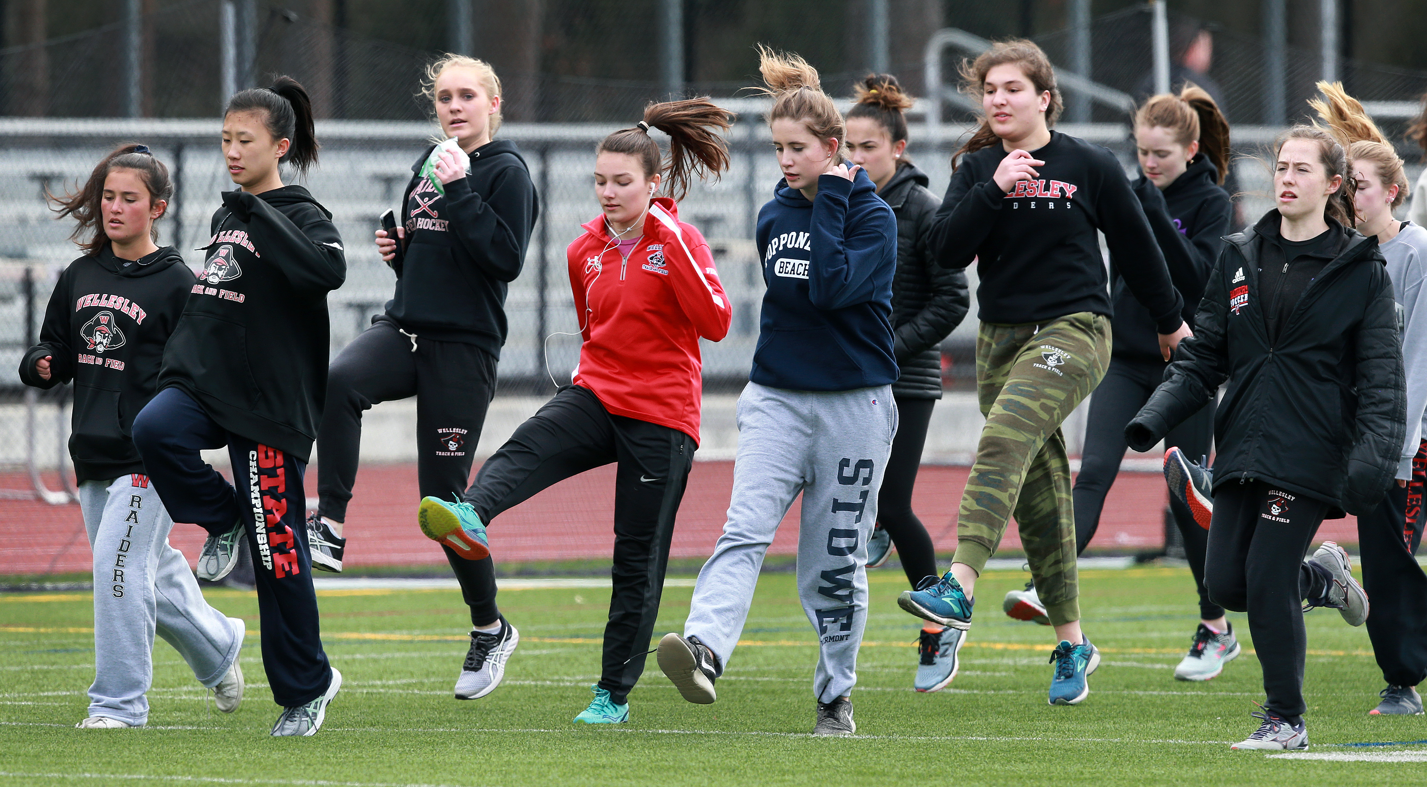 The Wellesley girls warm up for their meet against Framingham.
