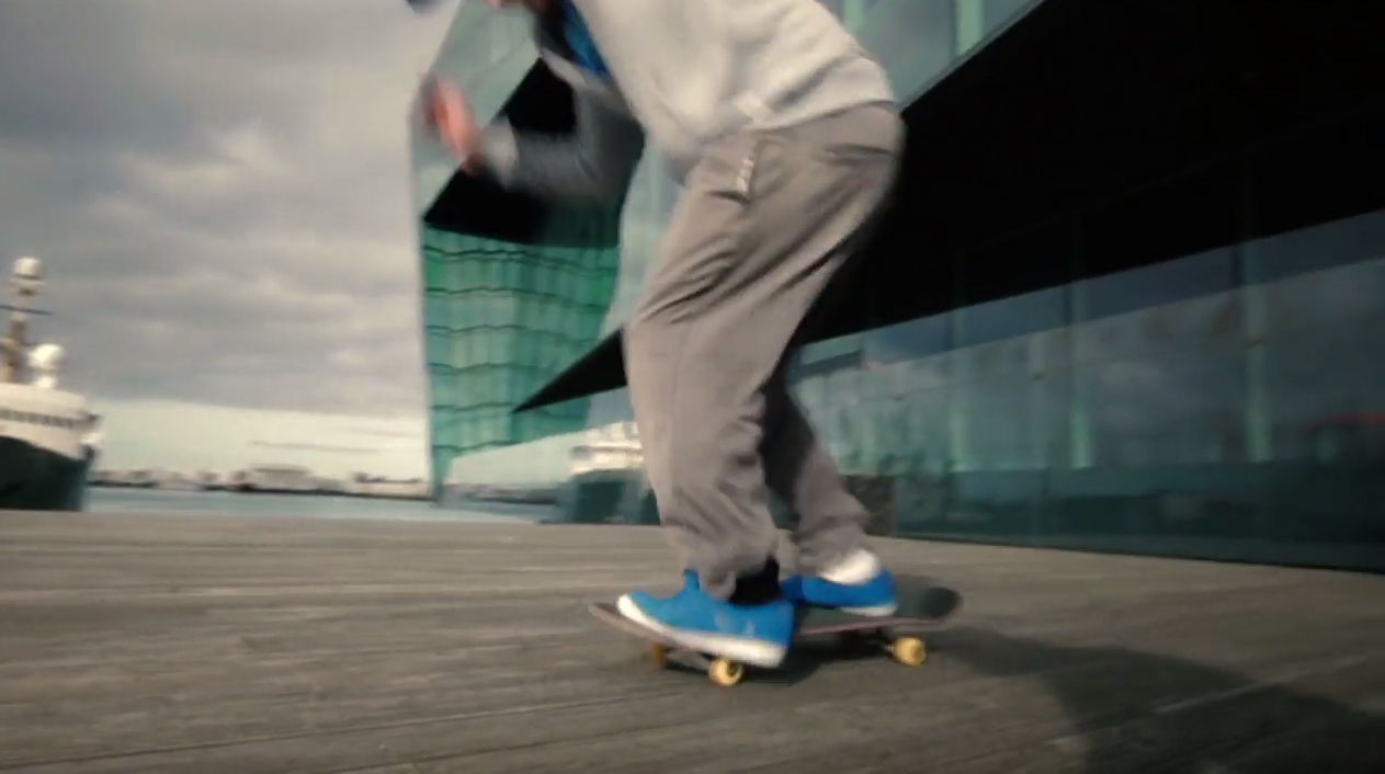 The video features the Harpa concert hall and conference center in Reykjavik.