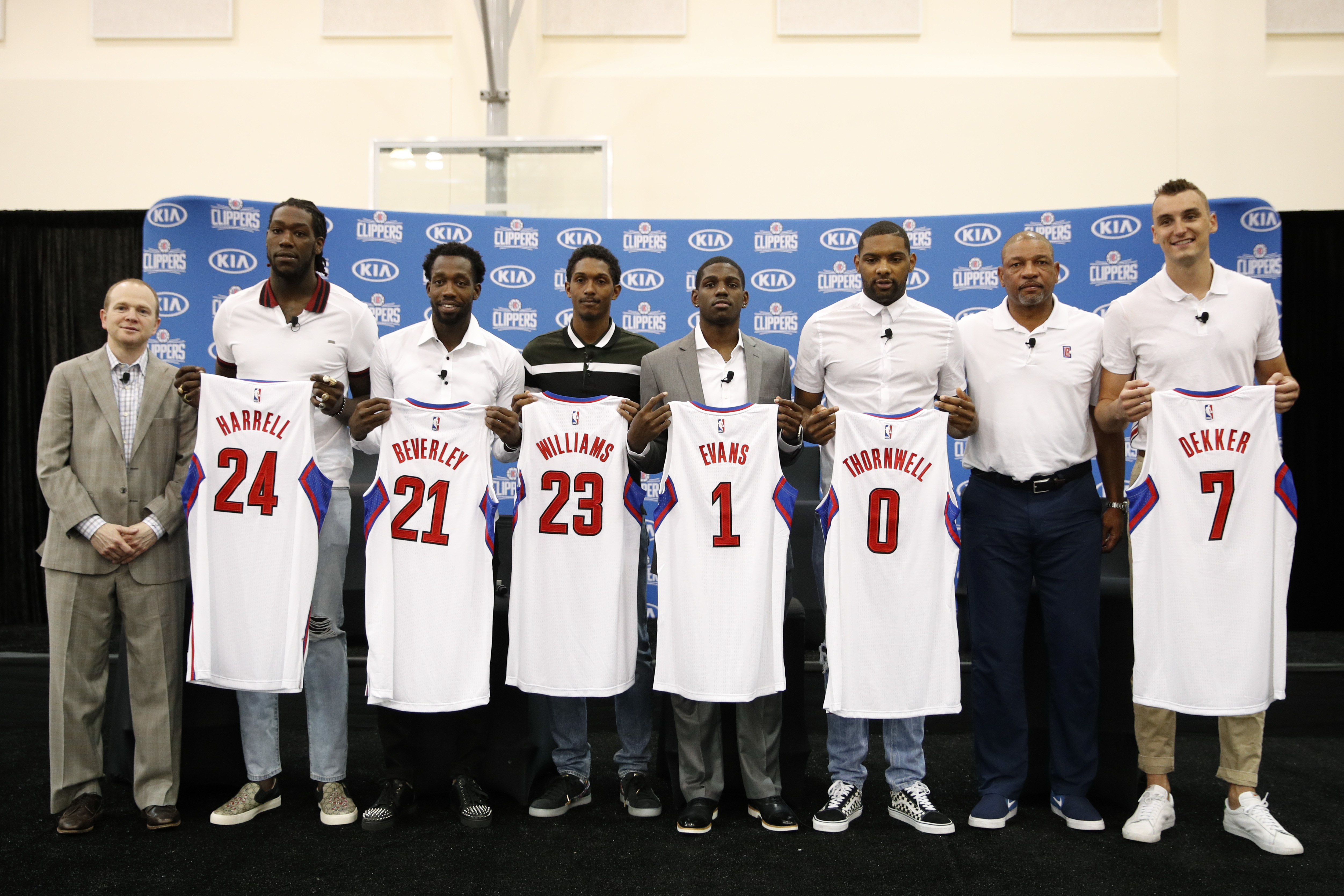From left, executive vice president of basketball operations Lawrence Frank, center Montrezl Harrell, guard Patrick Beverley, guard Lou Williams, guard Jawun Evans, guard Sindarius Thornwell, coach Doc Rivers and forward Sam Dekker.