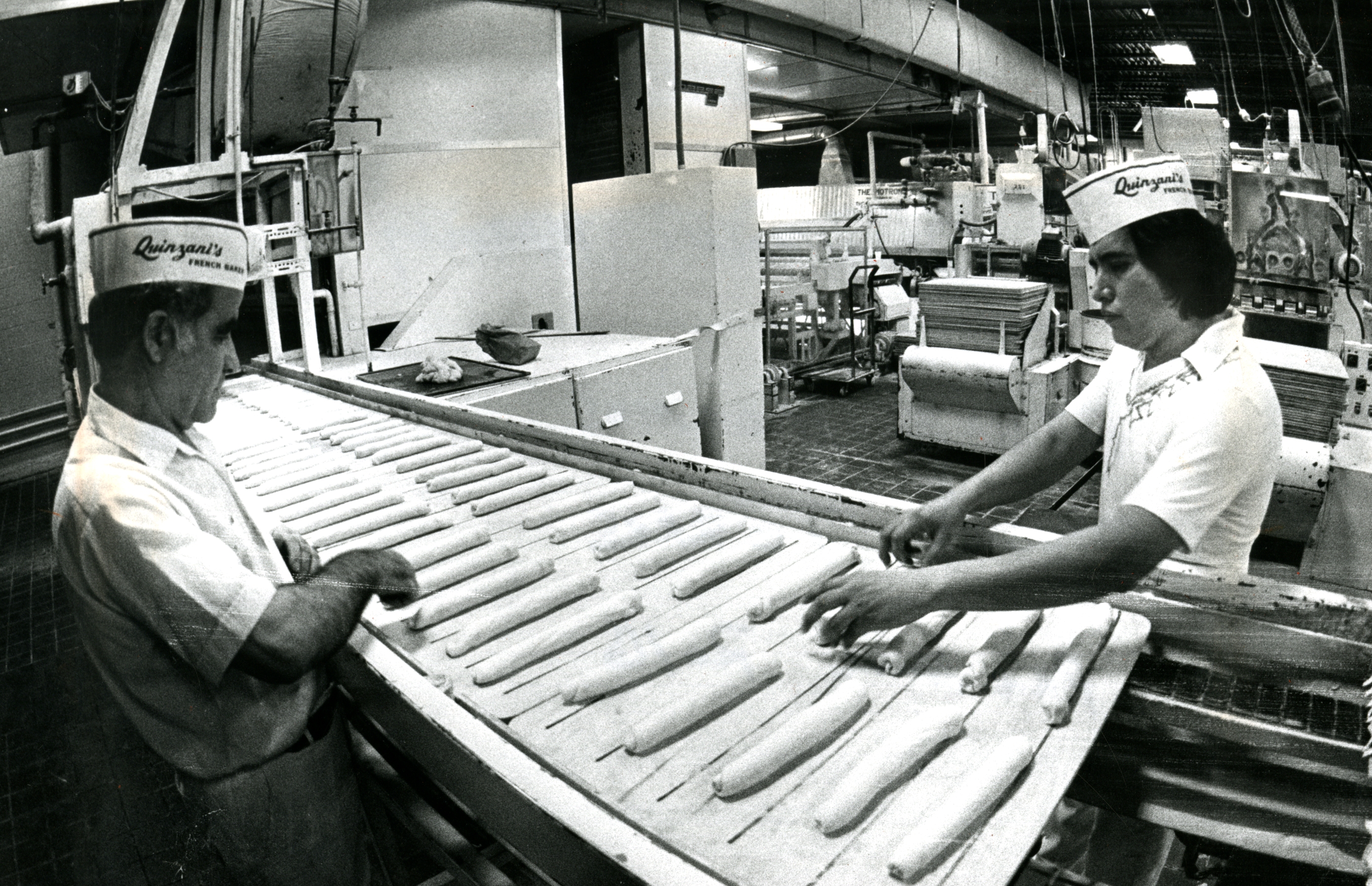 Quinzani Bakery workers prepared rolls in 1980.